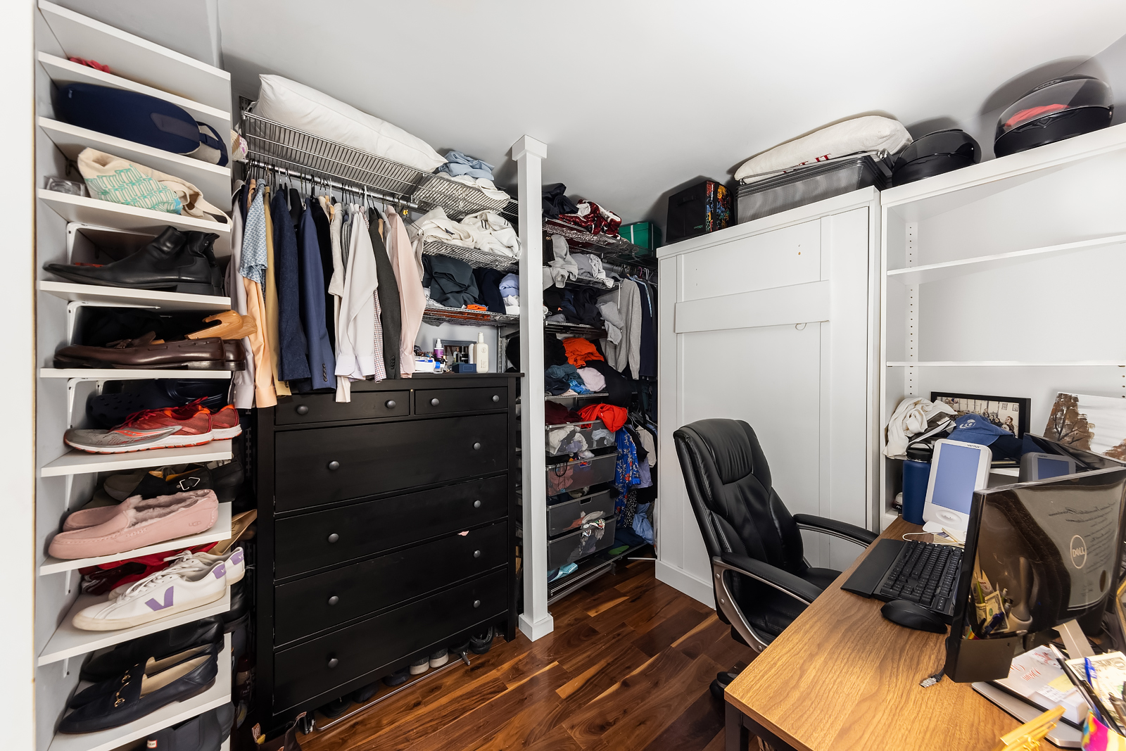 33 Greenwich Avenue, Unit 4E Manhattan, NY 10014 - Photo 6 of 10 a view of walk in closet with clothes and shoes