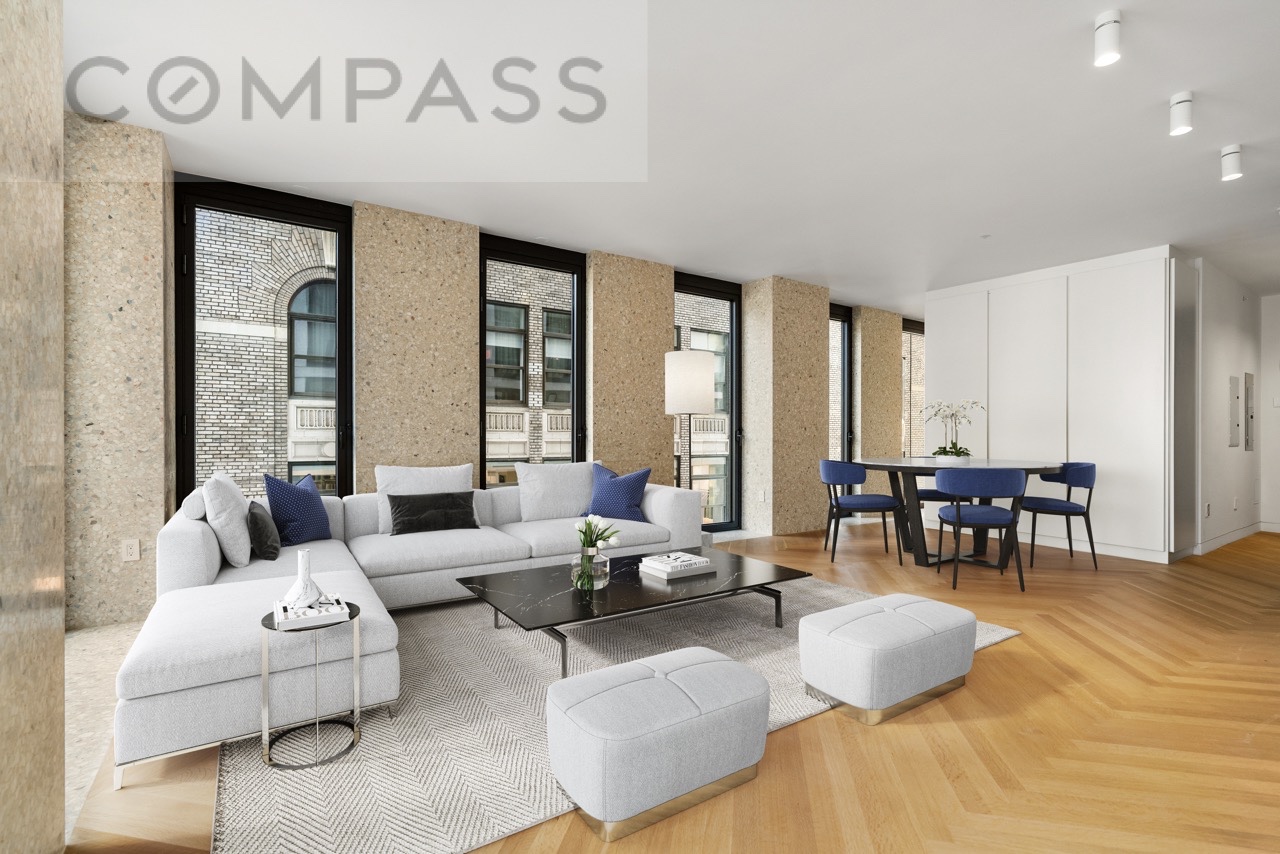 16 West 40th Street, Unit 21B Manhattan, NY 10018 - Photo 5 of 18 a living room with furniture and wooden floor