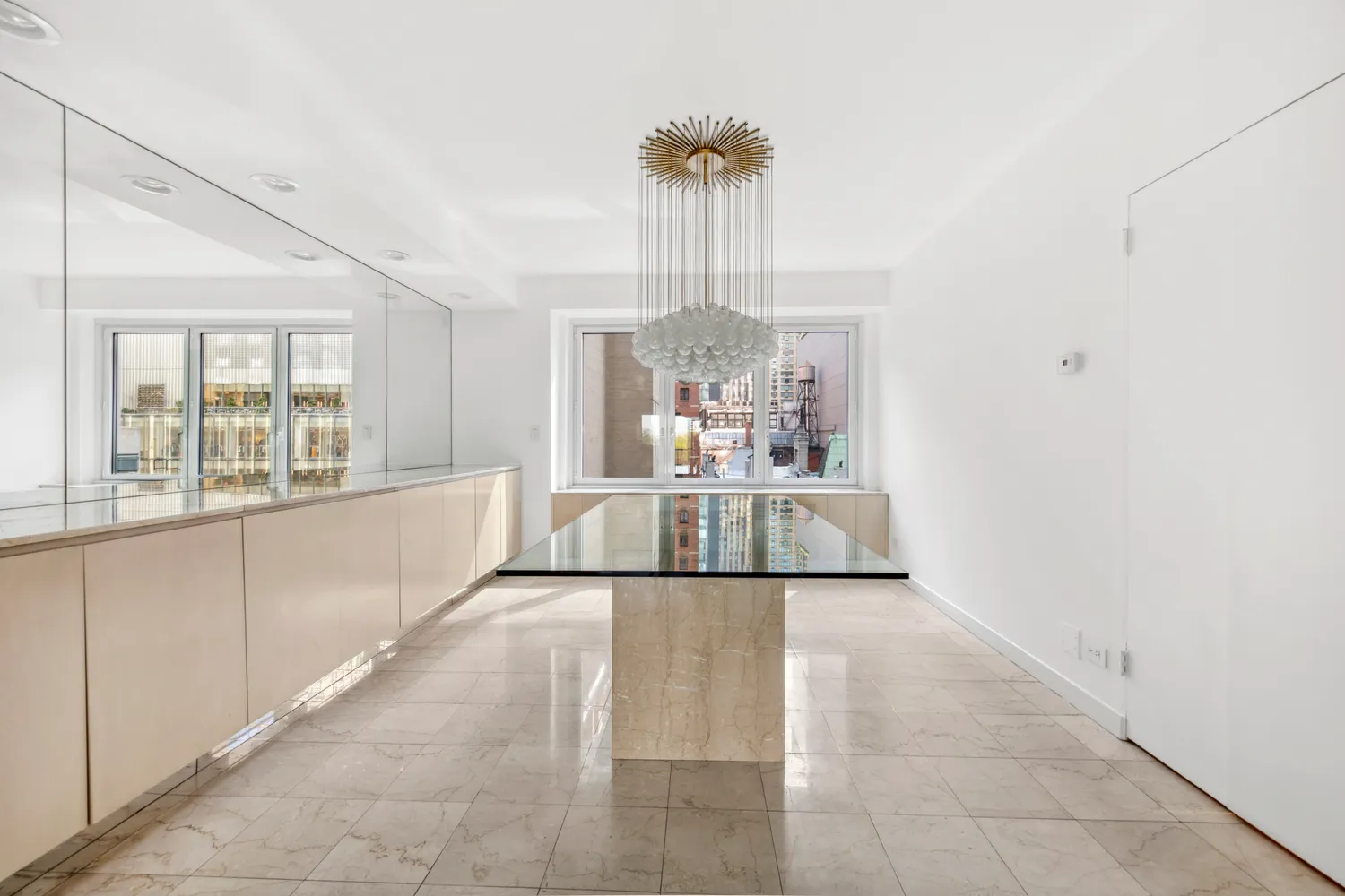 a view of a hallway with a chandelier