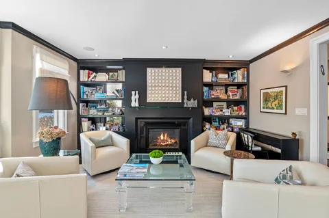 a bed sitting in a bedroom next to a cabinet