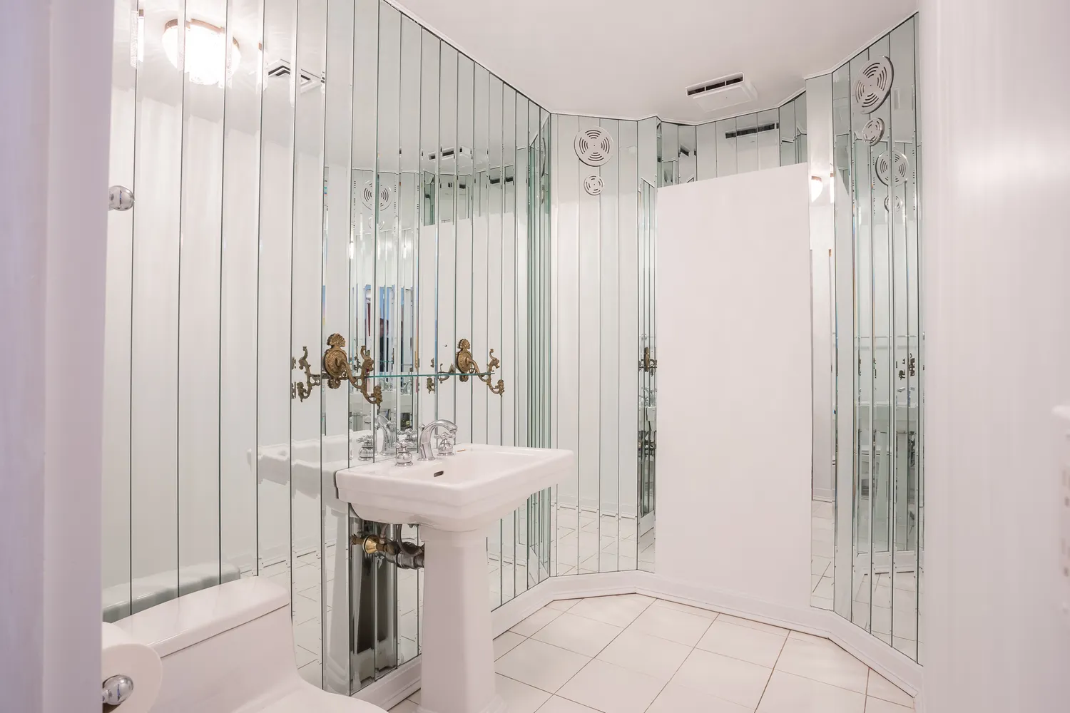 a bathroom with a sink a mirror and a shower