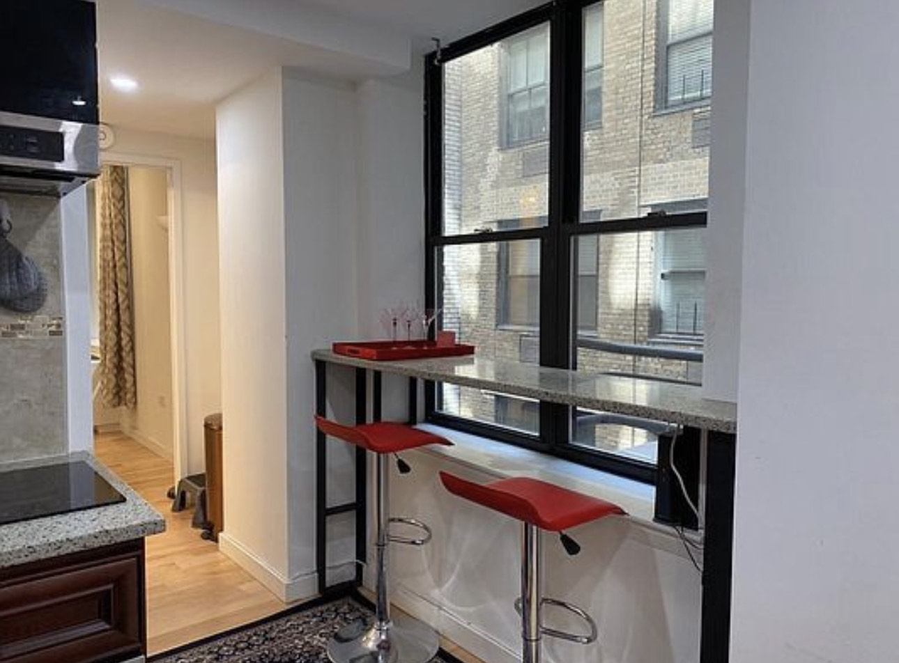 150 West 51st Street, Unit 1528 Manhattan, NY 10019 - Photo 7 of 21 a room with musical instruments