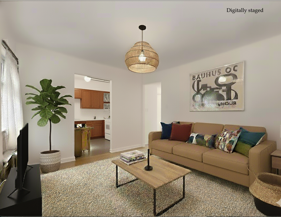 a living room with furniture plant and a large window