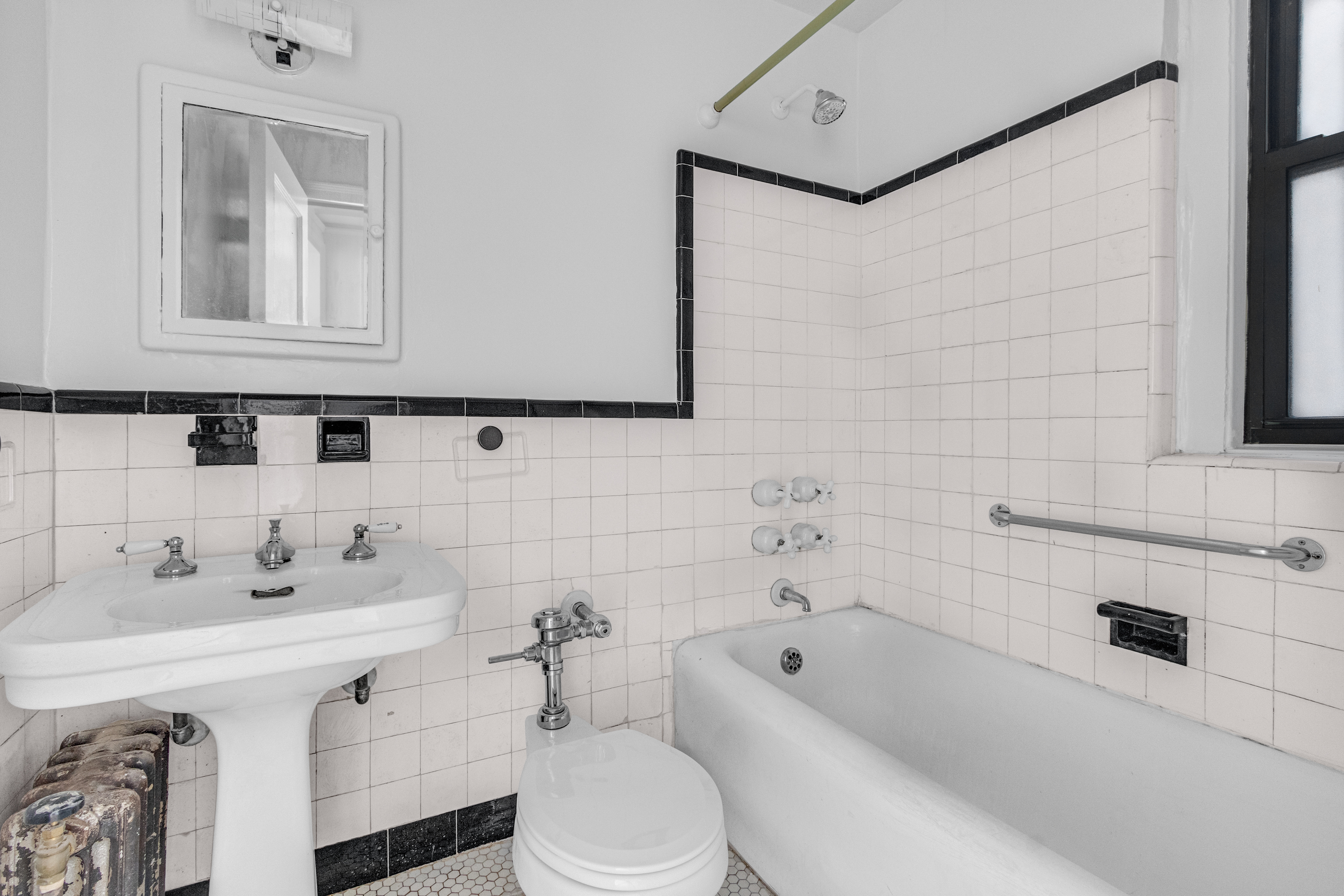 127 West 96th Street, Unit 4D Manhattan, NY 10025 - Photo 8 of 14 a bathroom with a sink a toilet and bathtub