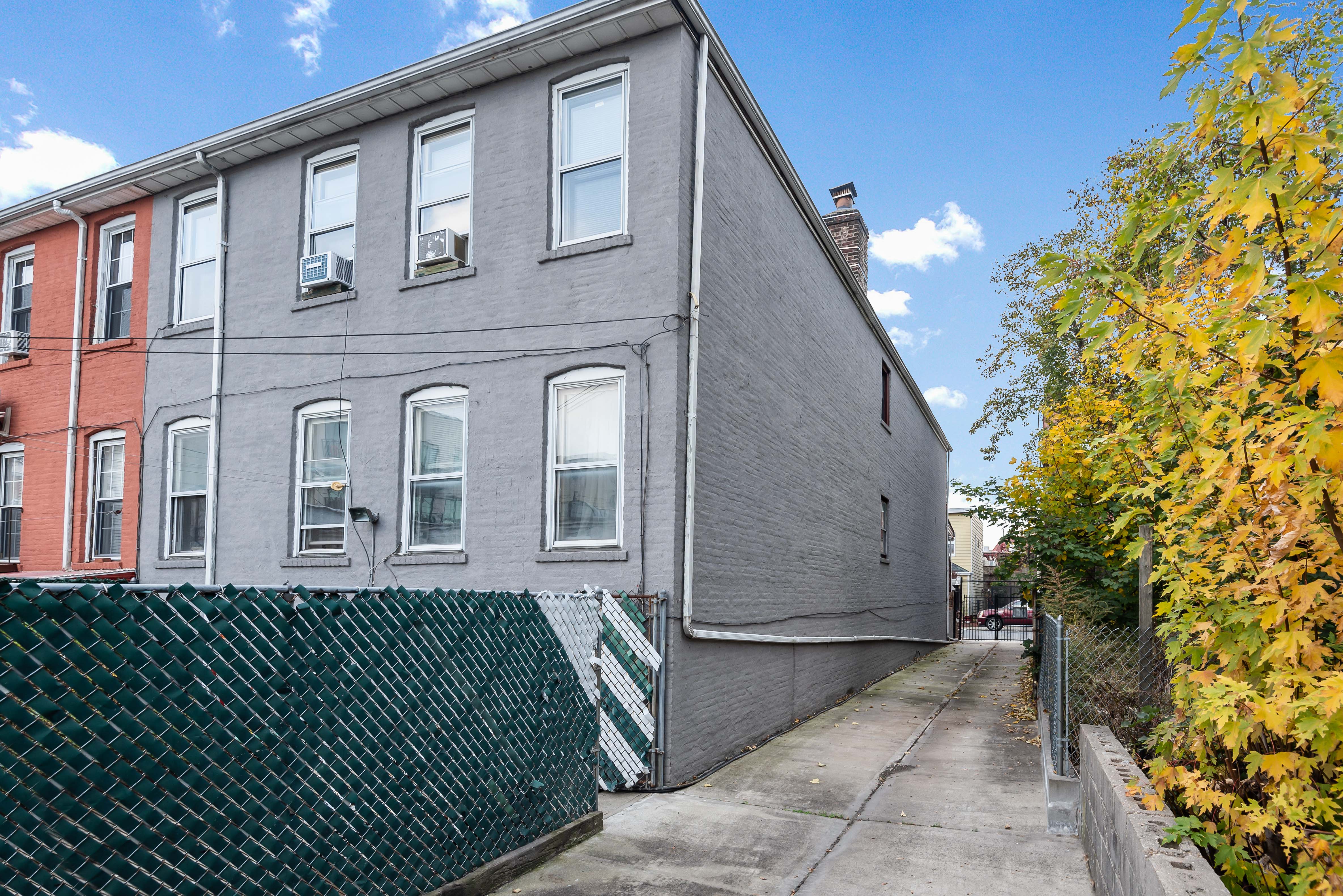 15 Lloyd Street Brooklyn, NY 11226 - Photo 15 of 18 a front view of a house with a garden