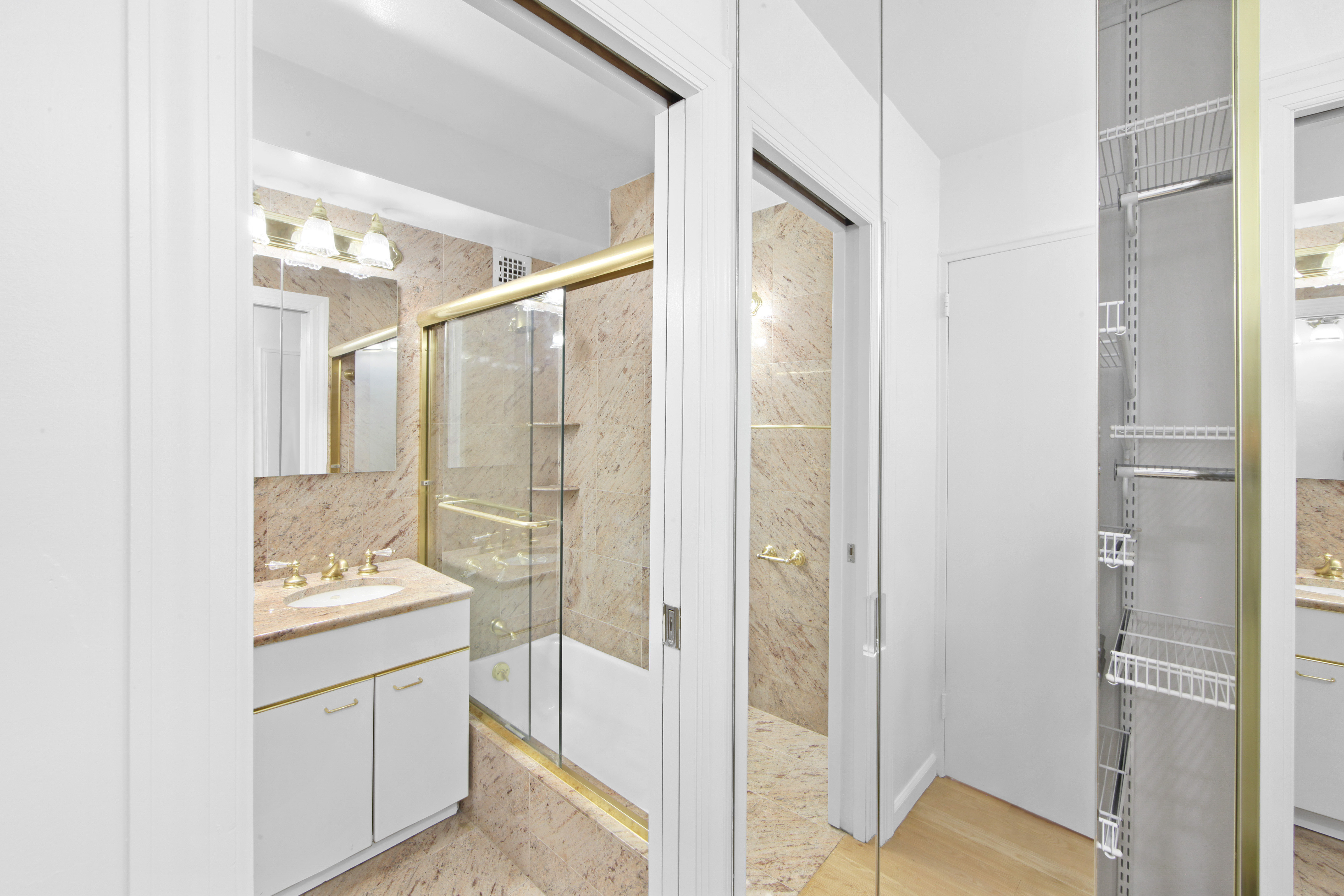 404 East 66th Street, Unit 11B Manhattan, NY 10065 - Photo 6 of 9 a bathroom with a bathtub and a sink