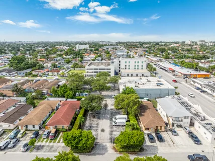 an aerial view of residential houses with outdoor space