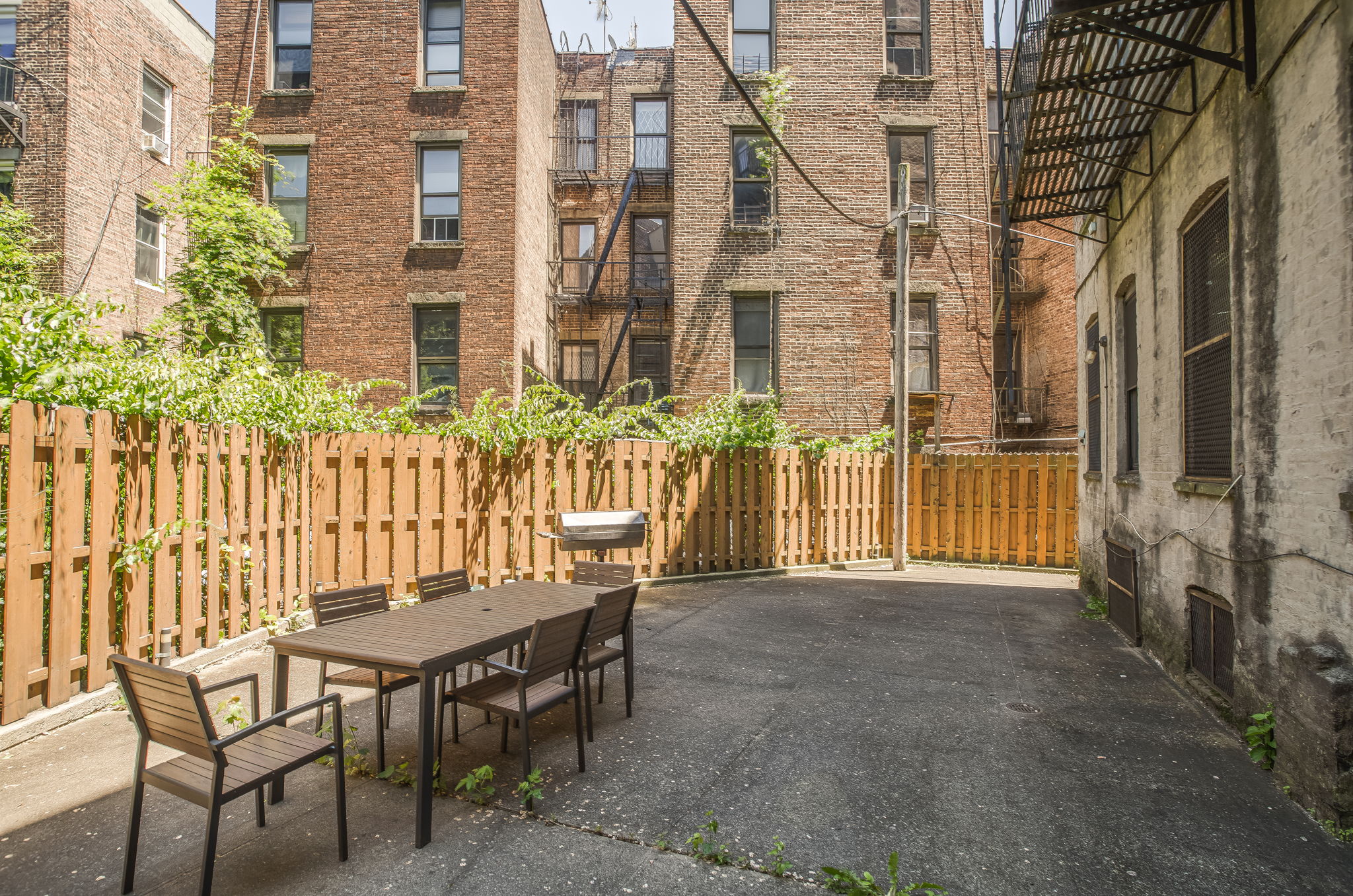 427 St Johns Place, Unit 2B Brooklyn, NY 11238 - Photo 9 of 11 a view of a brick house with a table and chairs