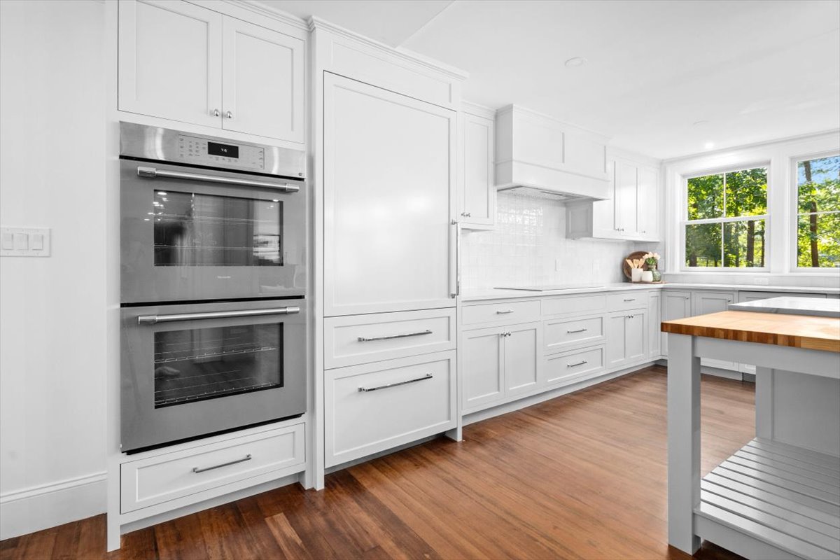 49 Garrison Road Hingham, MA 02043 - Photo 3 of 30 a kitchen with granite countertop white cabinets appliances and a window