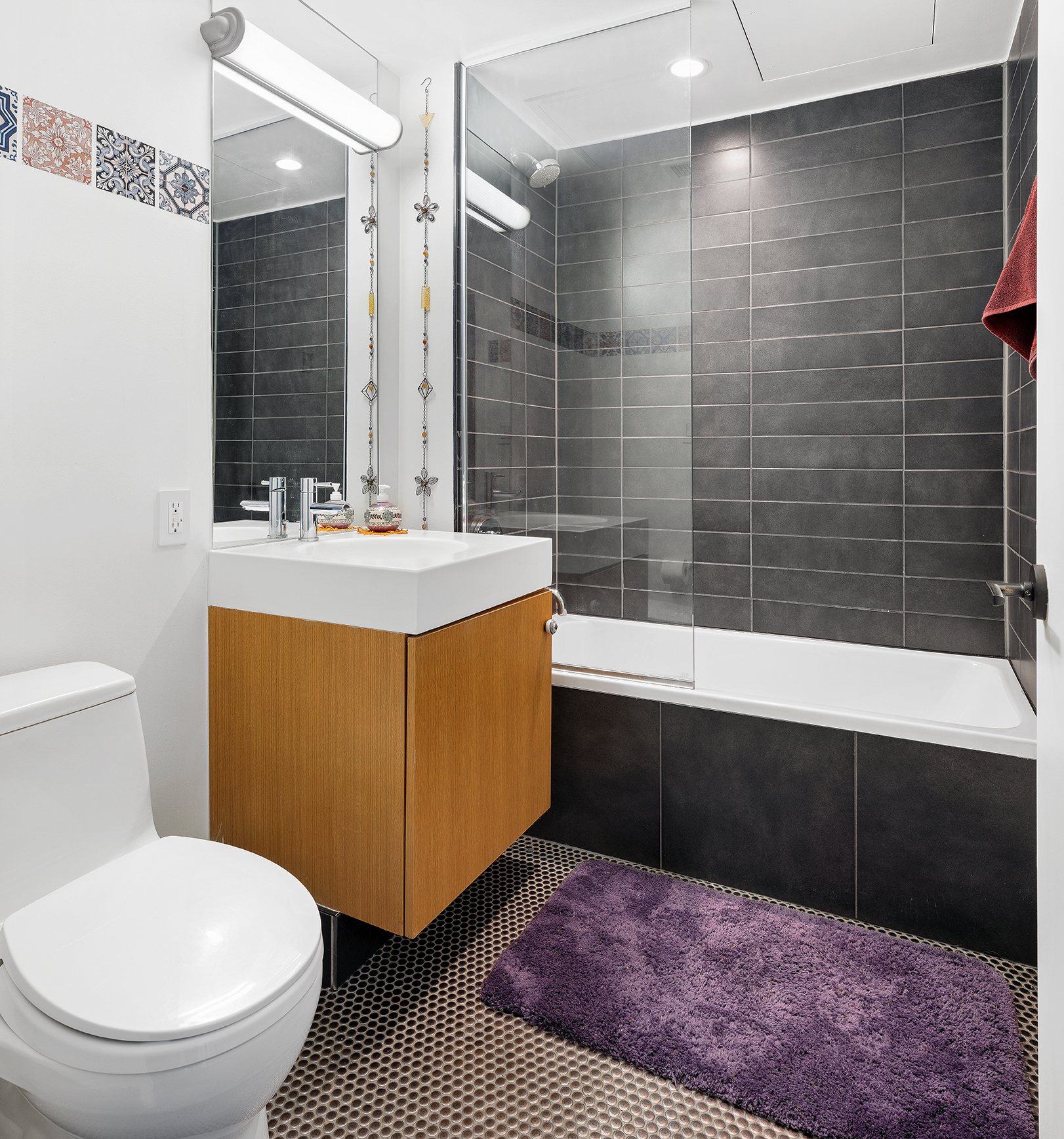 88 Morningside Avenue, Unit 8F Manhattan, NY 10027 - Photo 6 of 9 a bathroom with a sink a toilet and shower