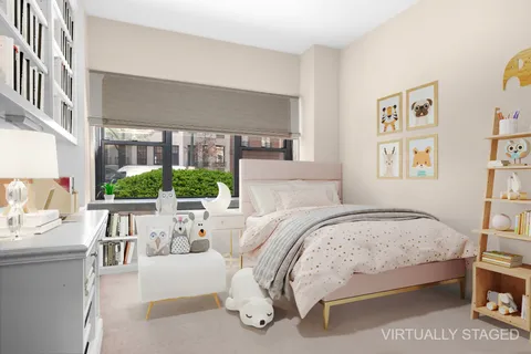 a bedroom with a bed and a table