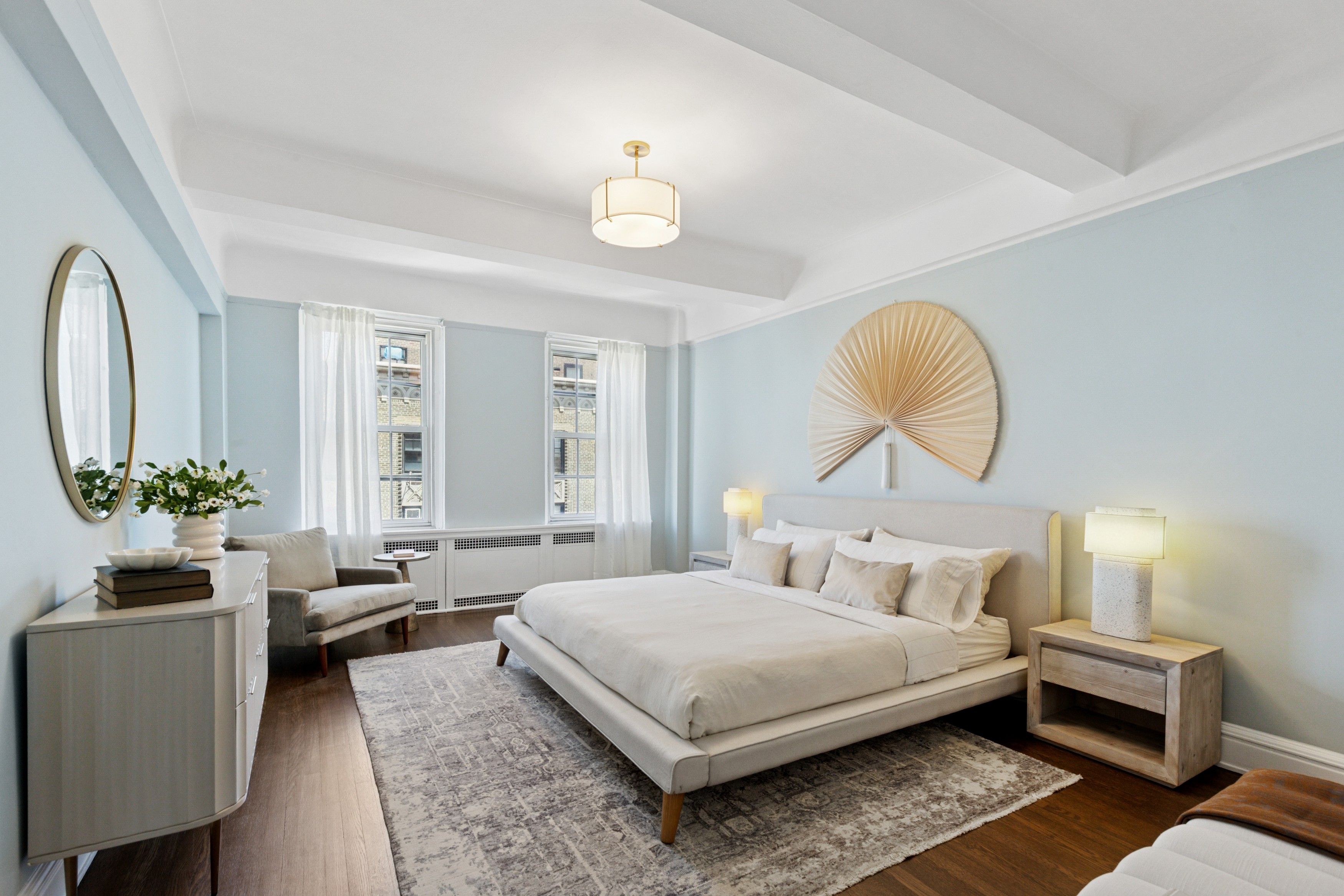 336 Central Park West, Unit 16F Manhattan, NY 10025 - Photo 9 of 18 a bedroom with a large bed and a chandelier