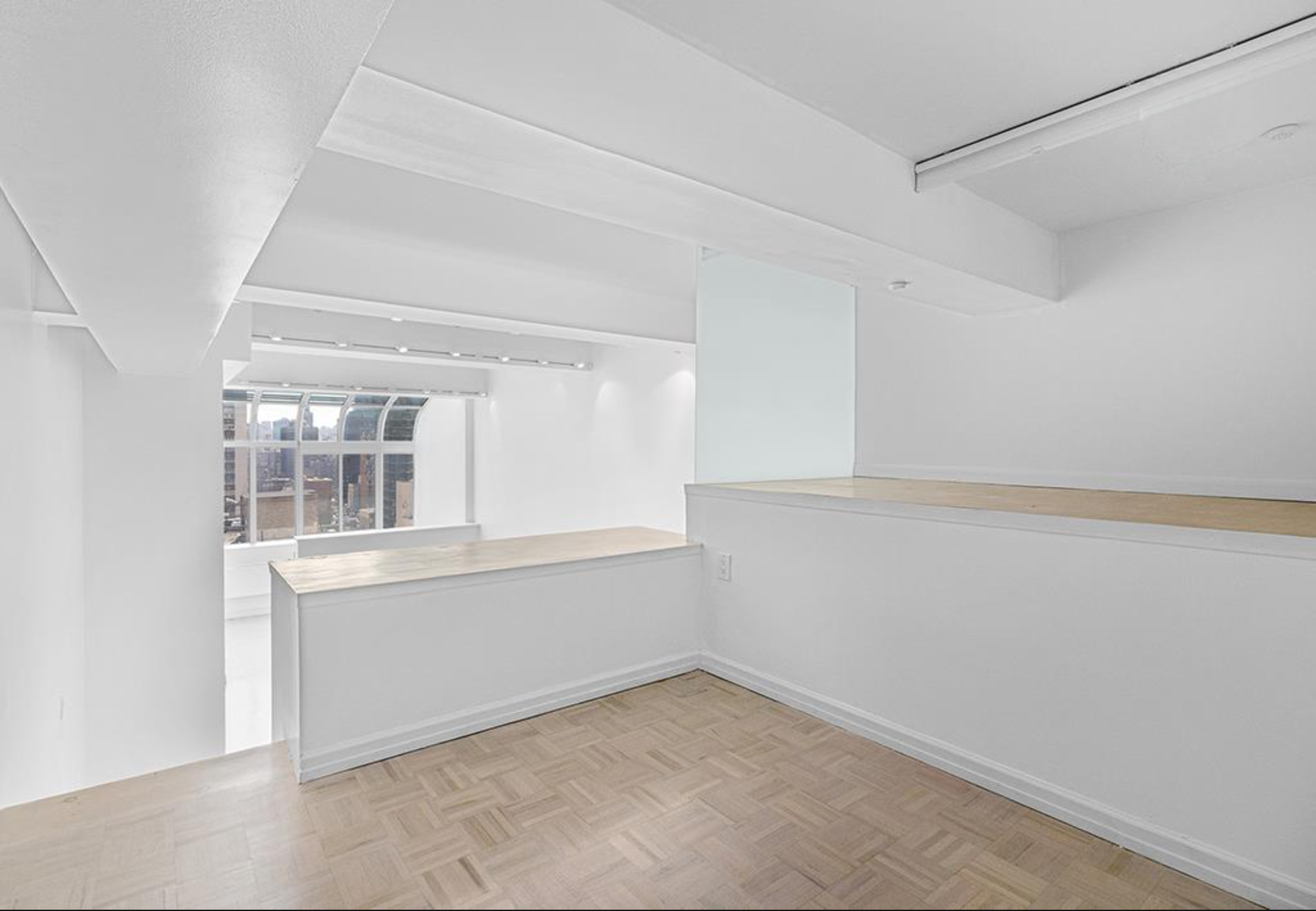 310 East 46th Street, Unit 19F Manhattan, NY 10017 - Photo 12 of 17 a view of an empty room with a window