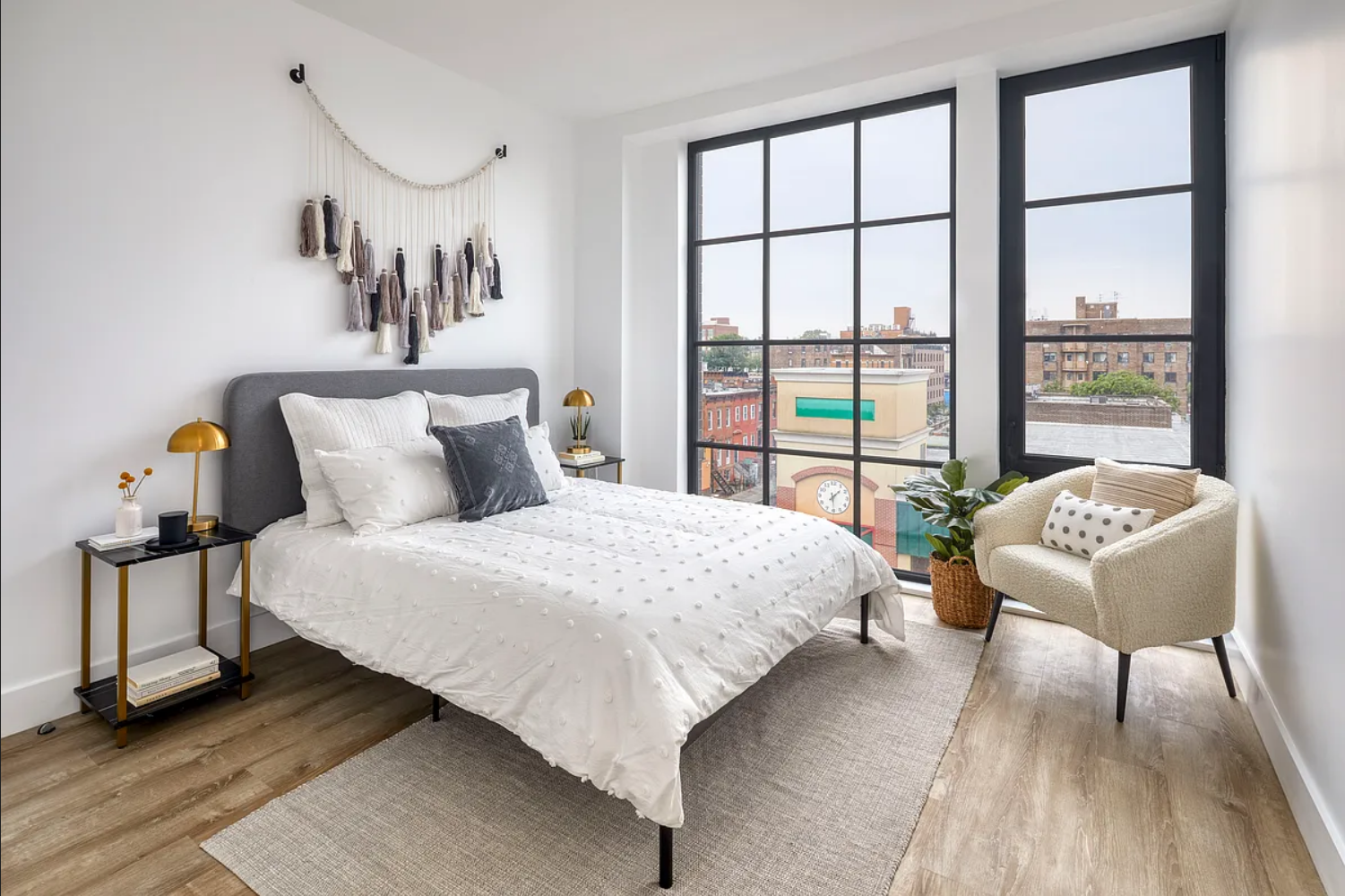 1425 Fulton Street, Unit 4A Brooklyn, NY 11216 - Photo 9 of 12 a bedroom with a bed and a large window