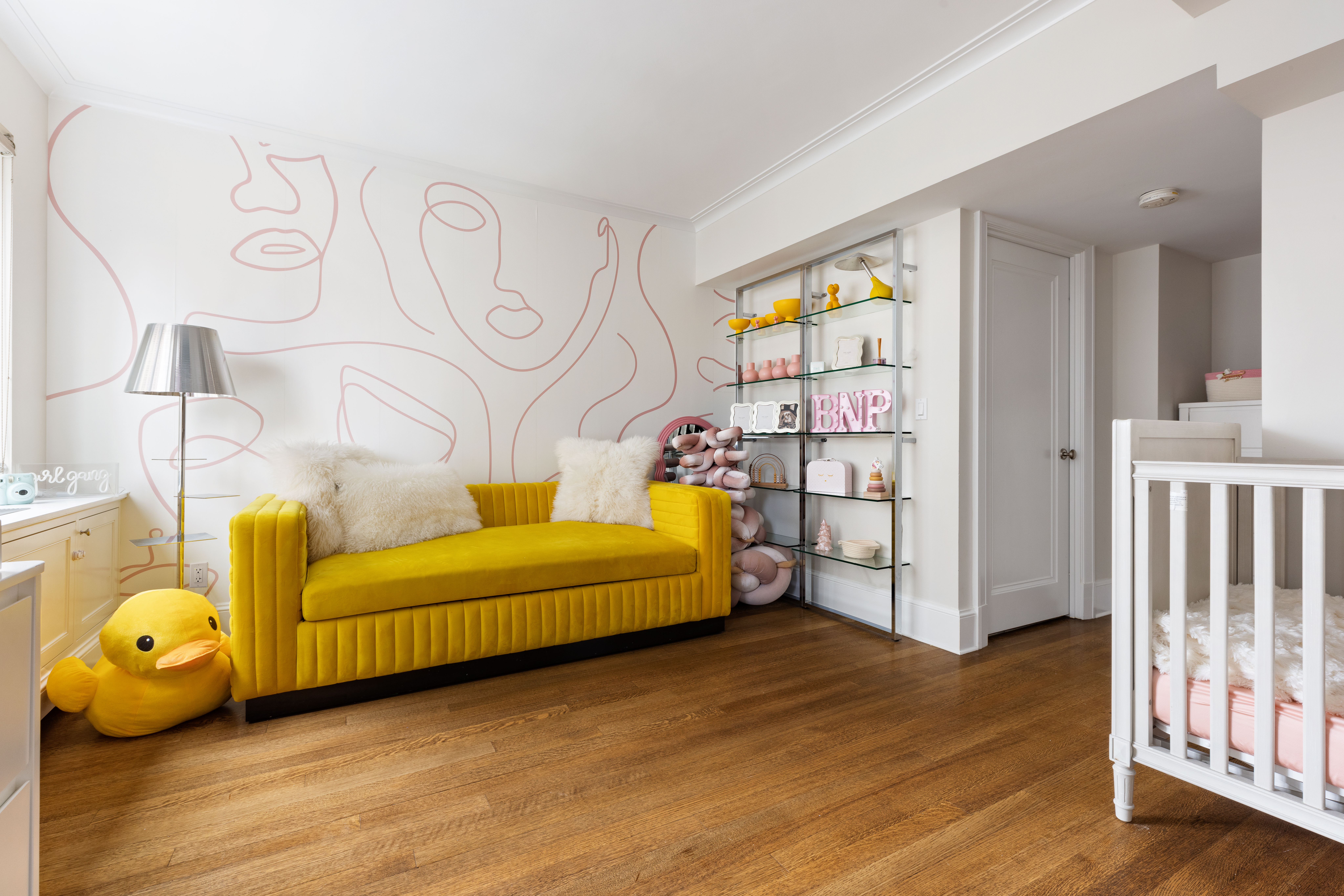 530 Park Avenue, Unit 14D Manhattan, NY 10065 - Photo 8 of 16 a living room with furniture and a window
