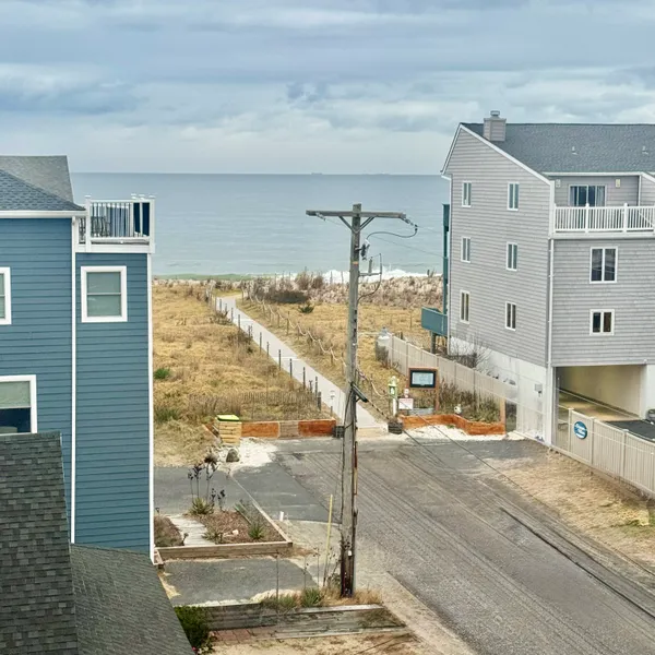 a bedroom with a bed and painting on the wall