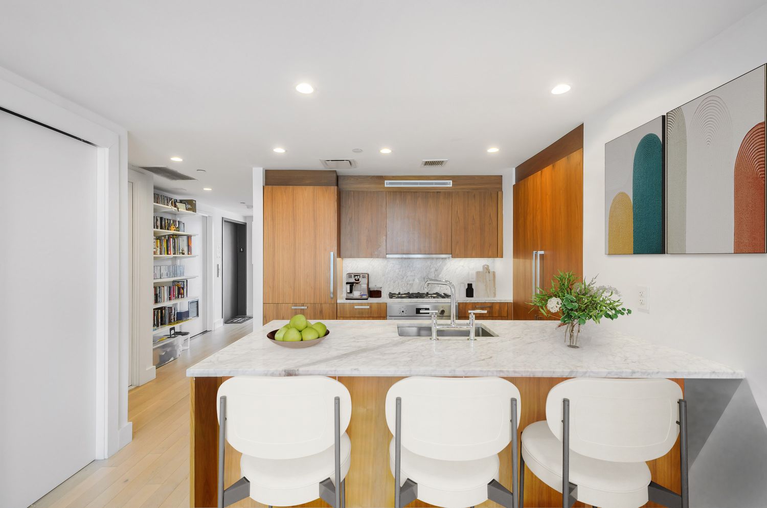 476 Union Avenue, Unit PH5A Brooklyn, NY 11211 - Photo 14 of 17 a living room with kitchen island furniture and a potted plant