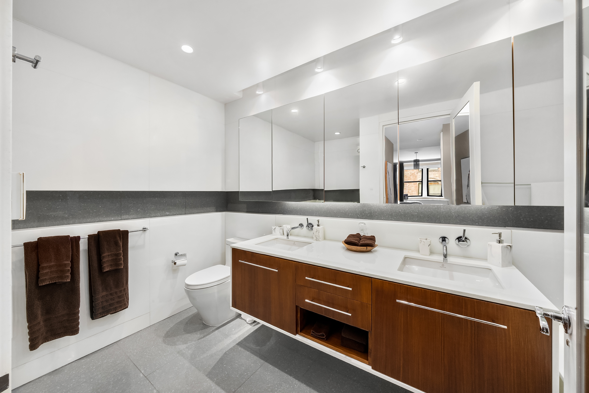 110 Central Park South, Unit 12ABC Manhattan, NY 10019 - Photo 37 of 49 a bathroom with a sink and a mirror