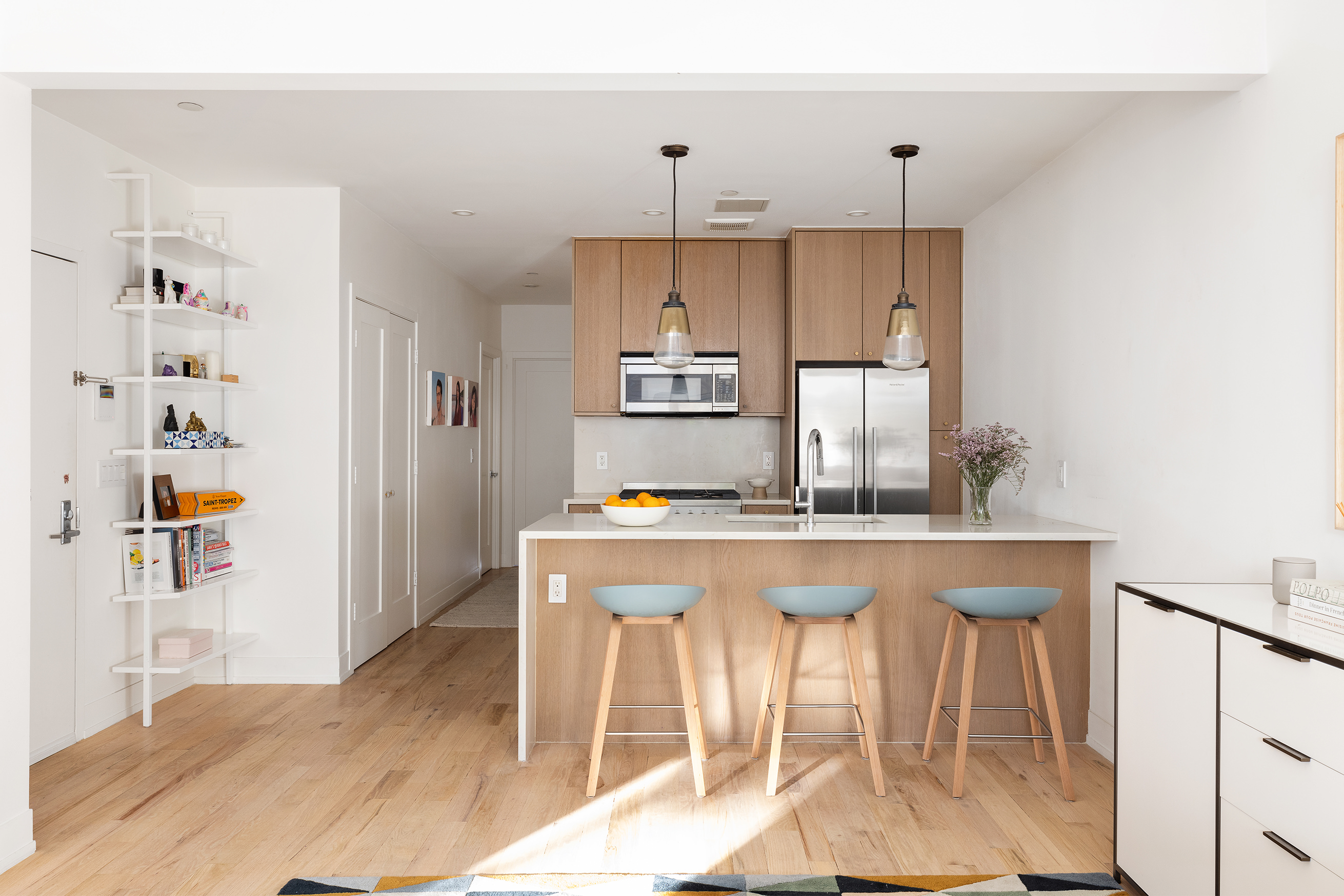 207 Wyckoff Street, Unit 2 Brooklyn, NY 11217 - Photo 6 of 15 a kitchen with stainless steel appliances a dining table chairs and stove top oven