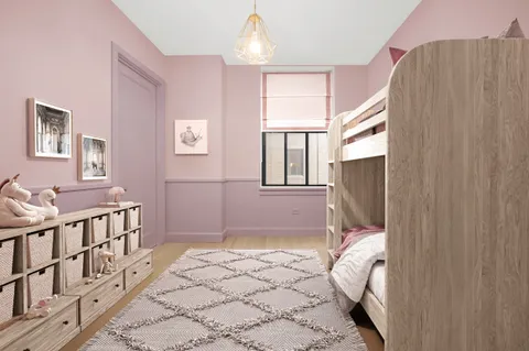 a bedroom with a bed next to a window