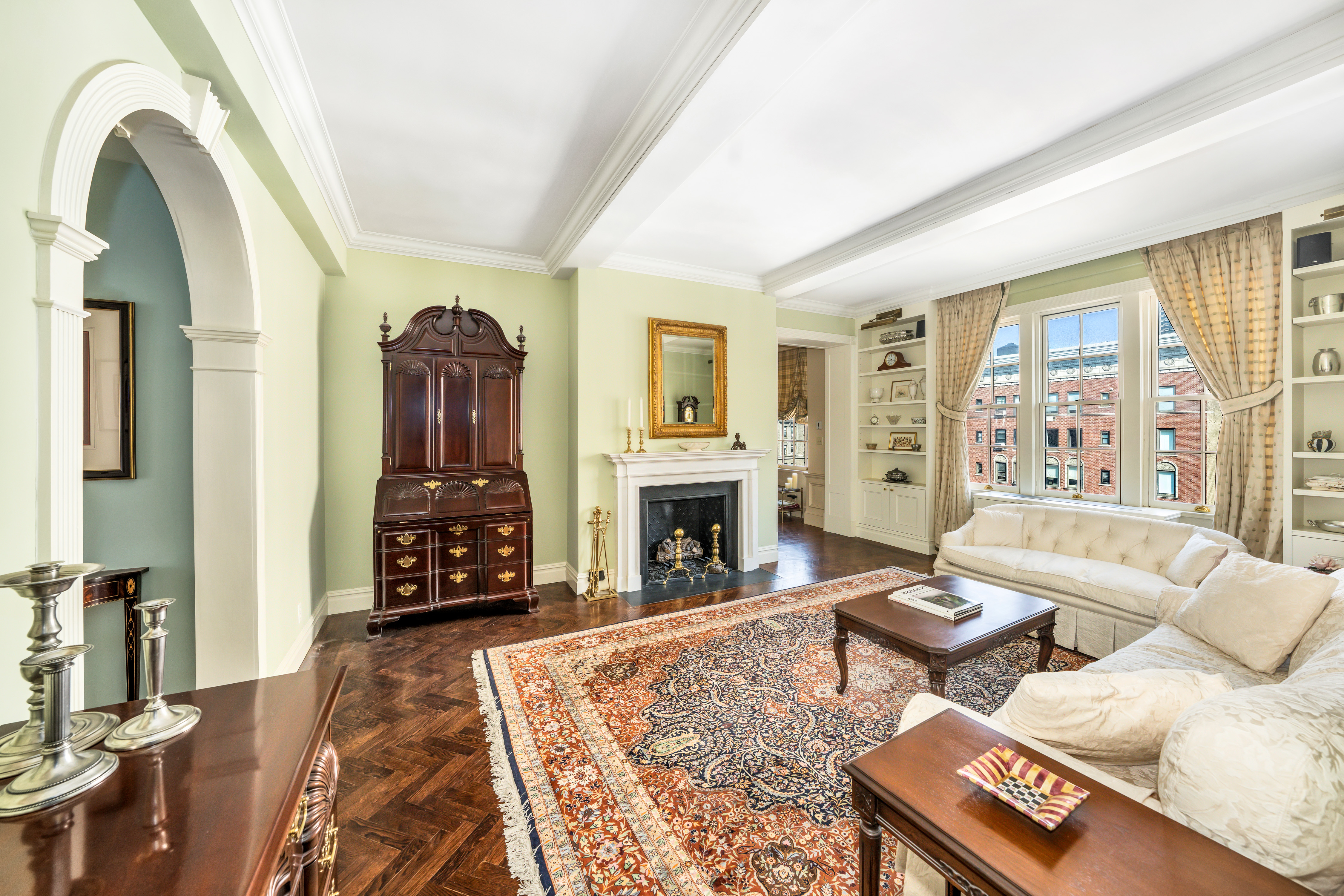 a living room with furniture a fireplace with wooden floor