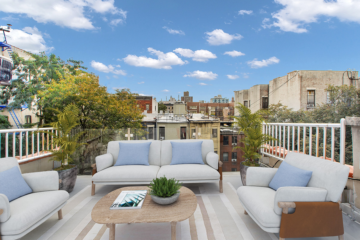 208 West 122nd Street Manhattan, NY 10027 - Photo 14 of 22 a balcony with furniture and a potted plant
