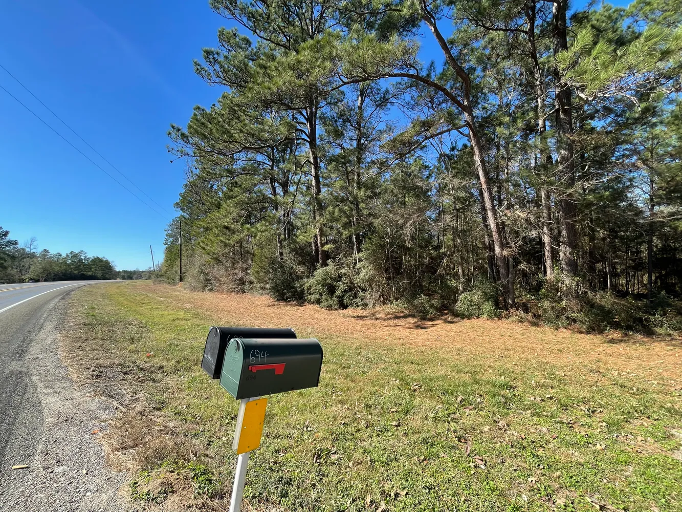 a view of a road with a yard
