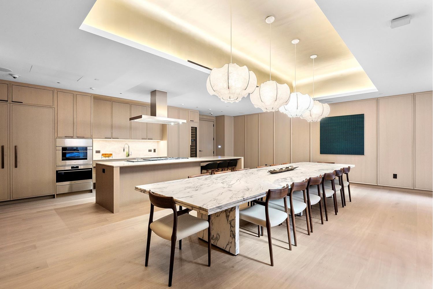 250 West 96th Street, Unit 18C Manhattan, NY 10025 - Photo 23 of 28 a kitchen with kitchen island a dining table and chairs