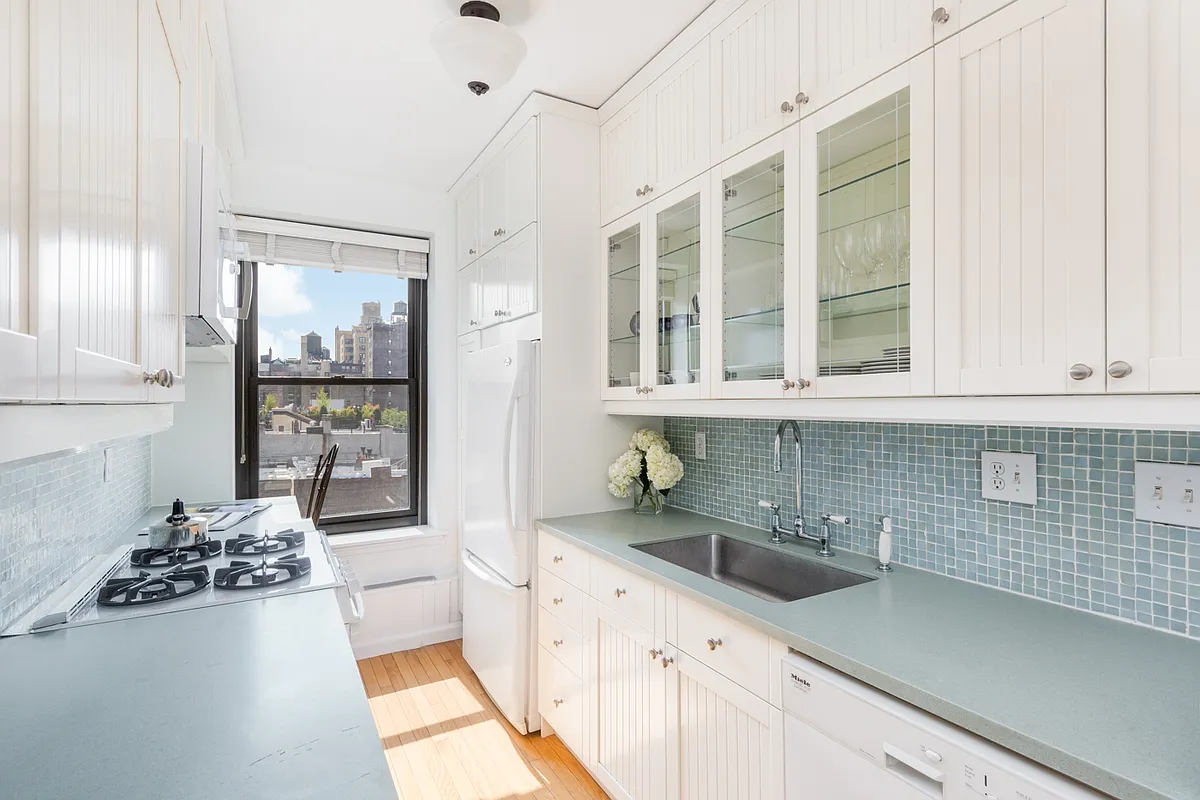 104 West 70th Street, Unit 7G Manhattan, NY 10023 - Photo 3 of 8 a kitchen with a sink and cabinets