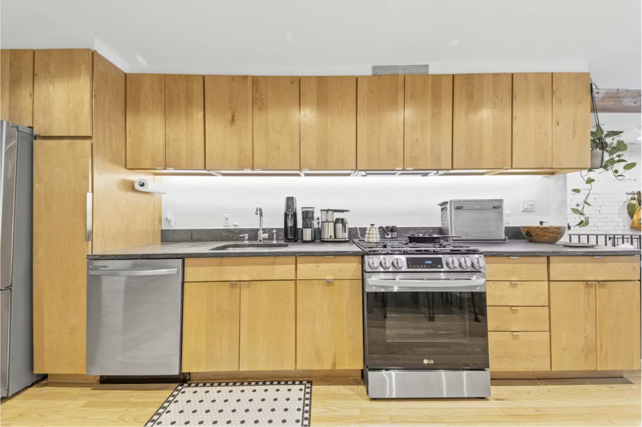 304 Warren Street, Unit 1 Brooklyn, NY 11201 - Photo 2 of 16 a kitchen with stainless steel appliances granite countertop a stove a sink dishwasher and a refrigerator