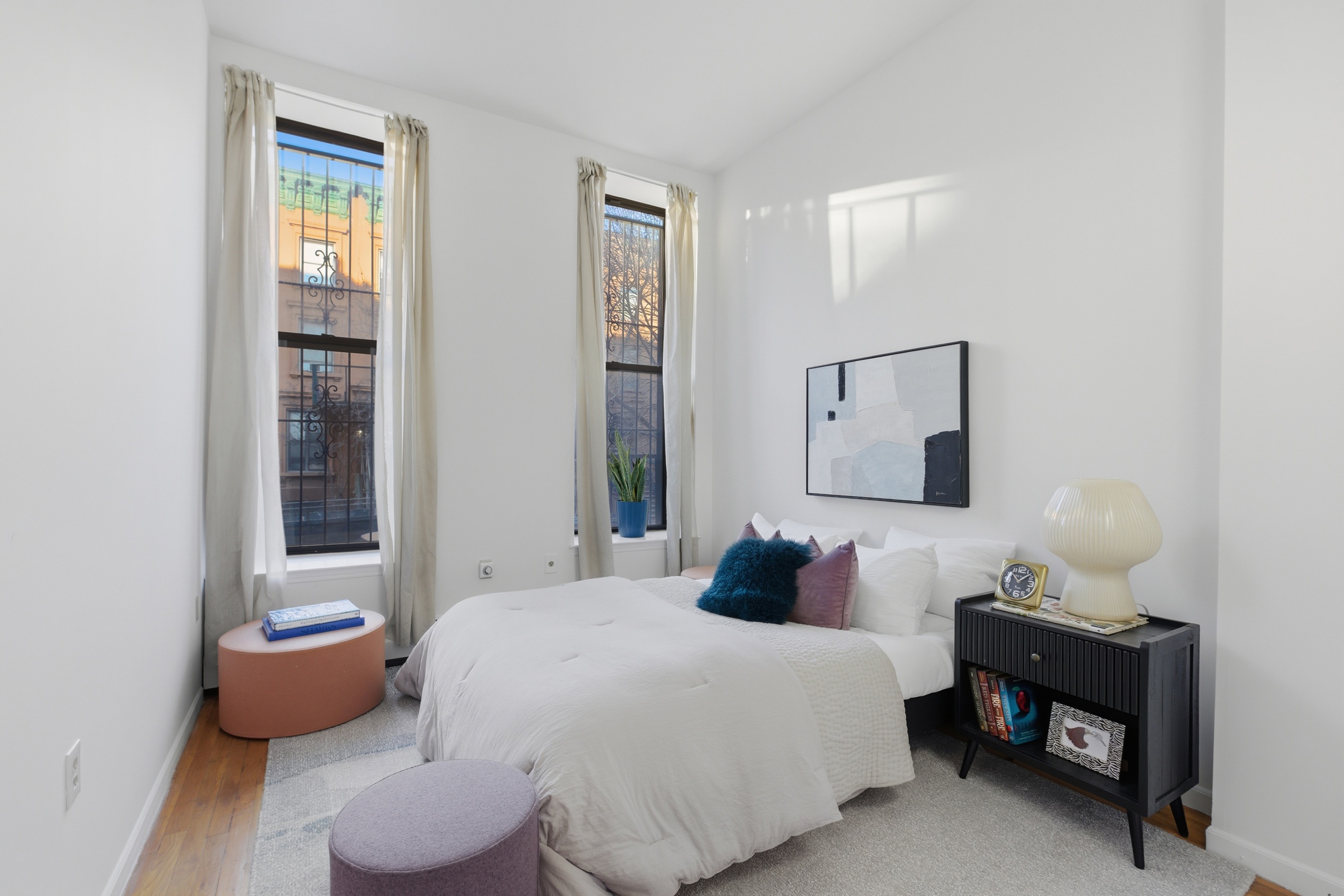 20 East 126th Street Manhattan, NY 10035 - Photo 6 of 19 a bedroom with bed and a night stand