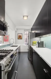 a kitchen with a stove and a sink