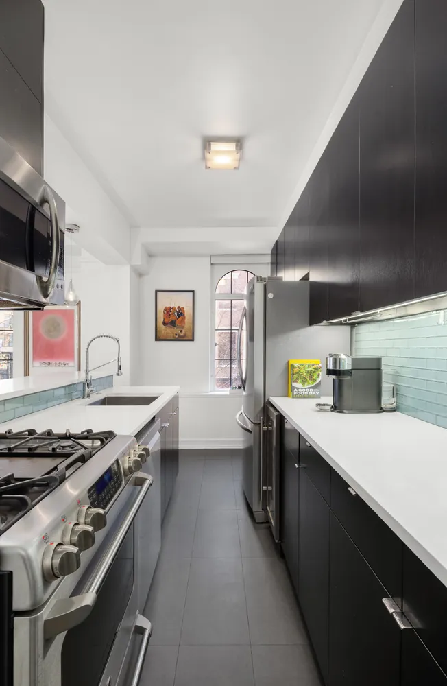 a kitchen with a stove and a sink