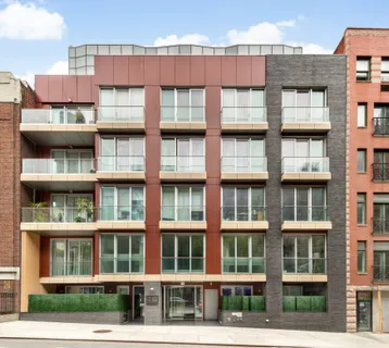 a front view of a building with balcony