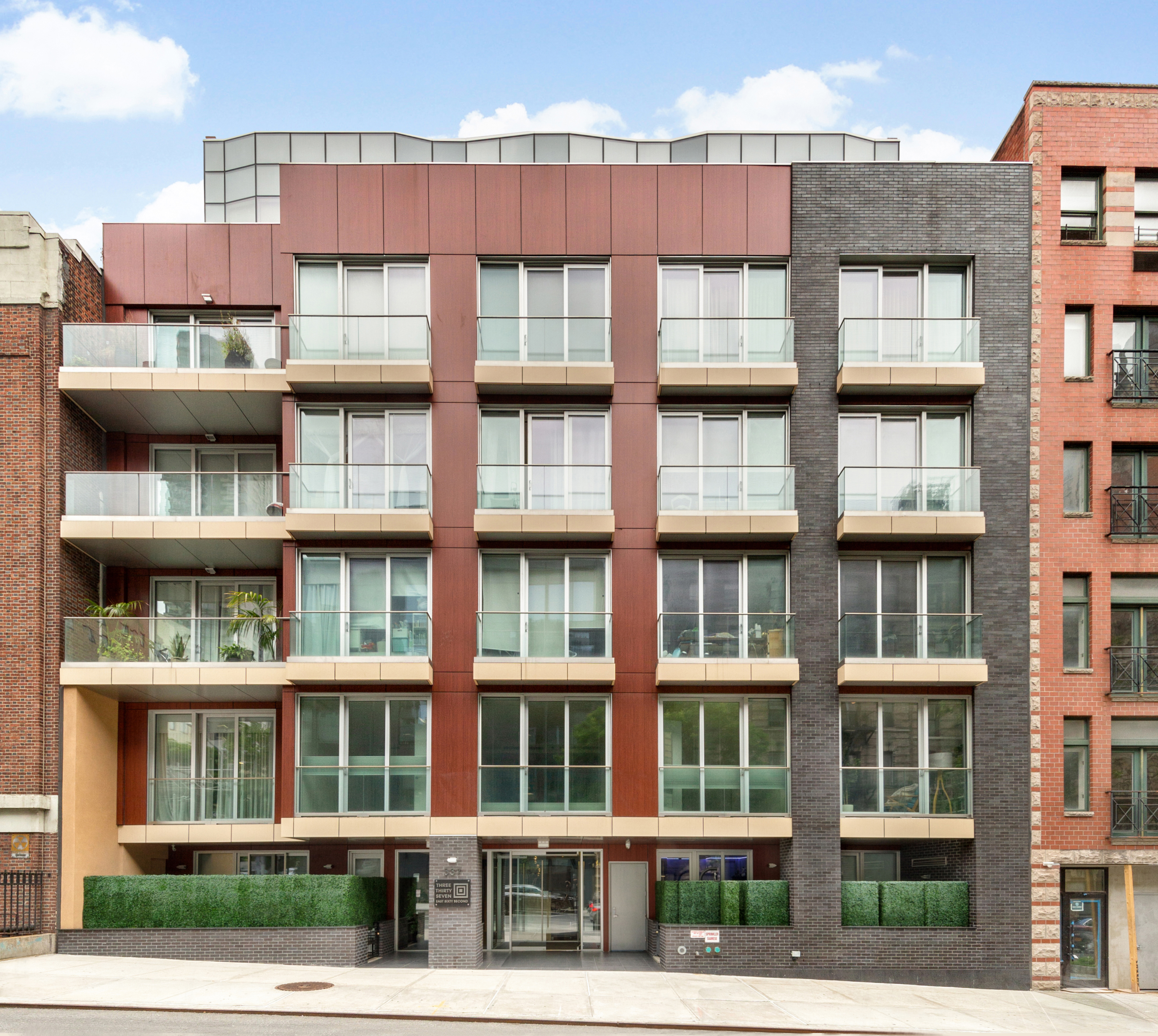 337 East 62nd Street, Unit 3C Manhattan, NY 10065 - Photo 13 of 14 a front view of a building with balcony