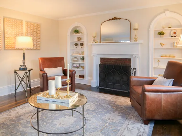 a living room with furniture and a fireplace