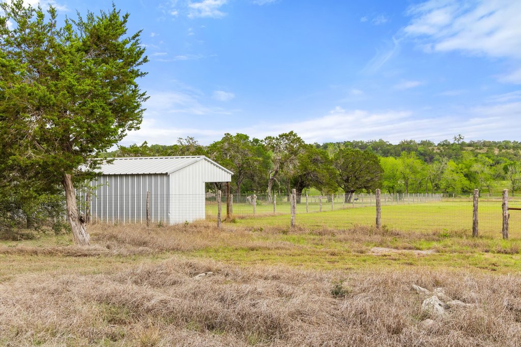 2560 Bell Springs Road Dripping Springs, TX 78620 - Photo 6 of 42 a view of a house with a backyard