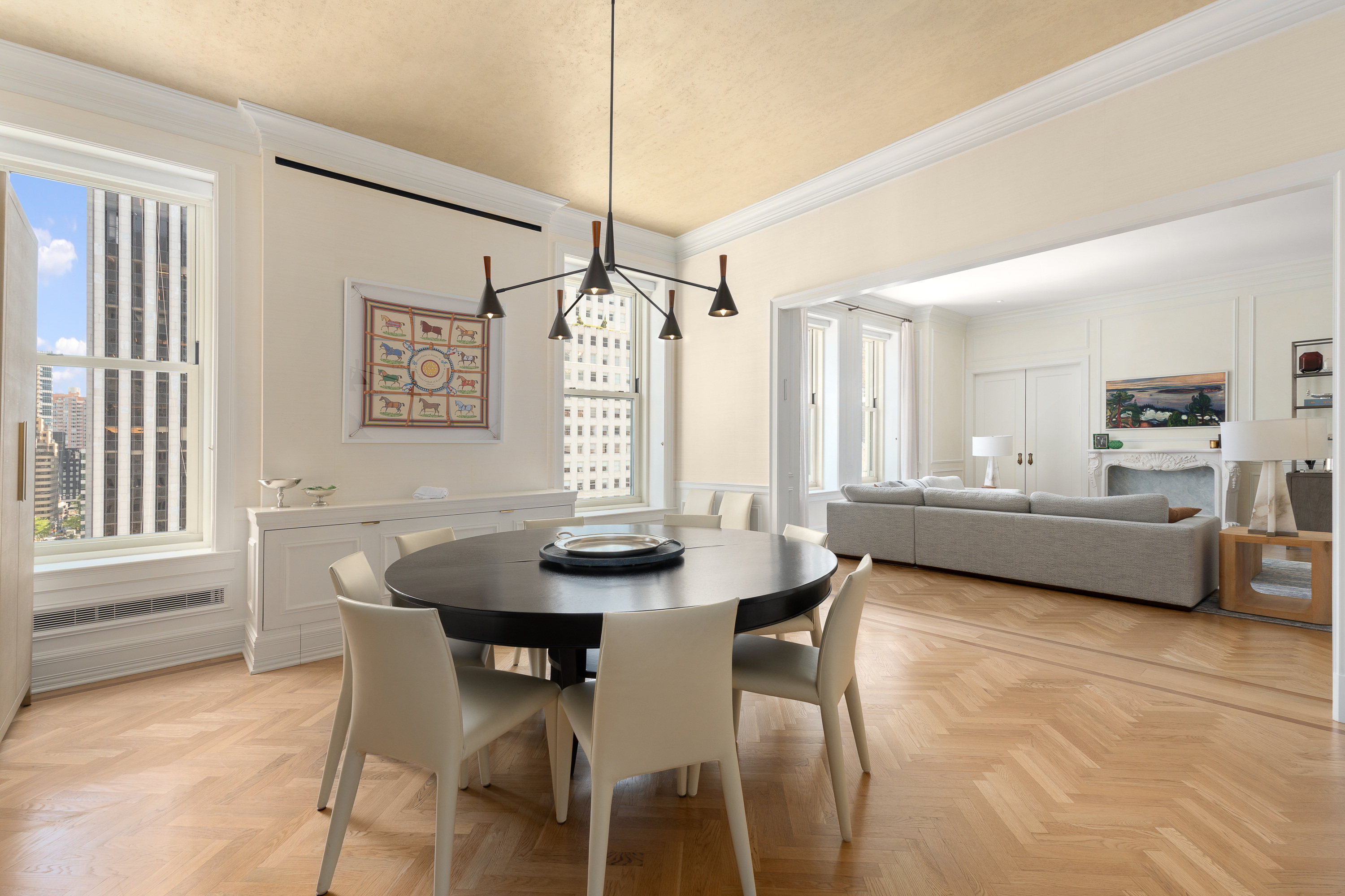 1 Central Park South, Unit 913 Manhattan, NY 10019 - Photo 2 of 23 a view of a dining room with furniture and window