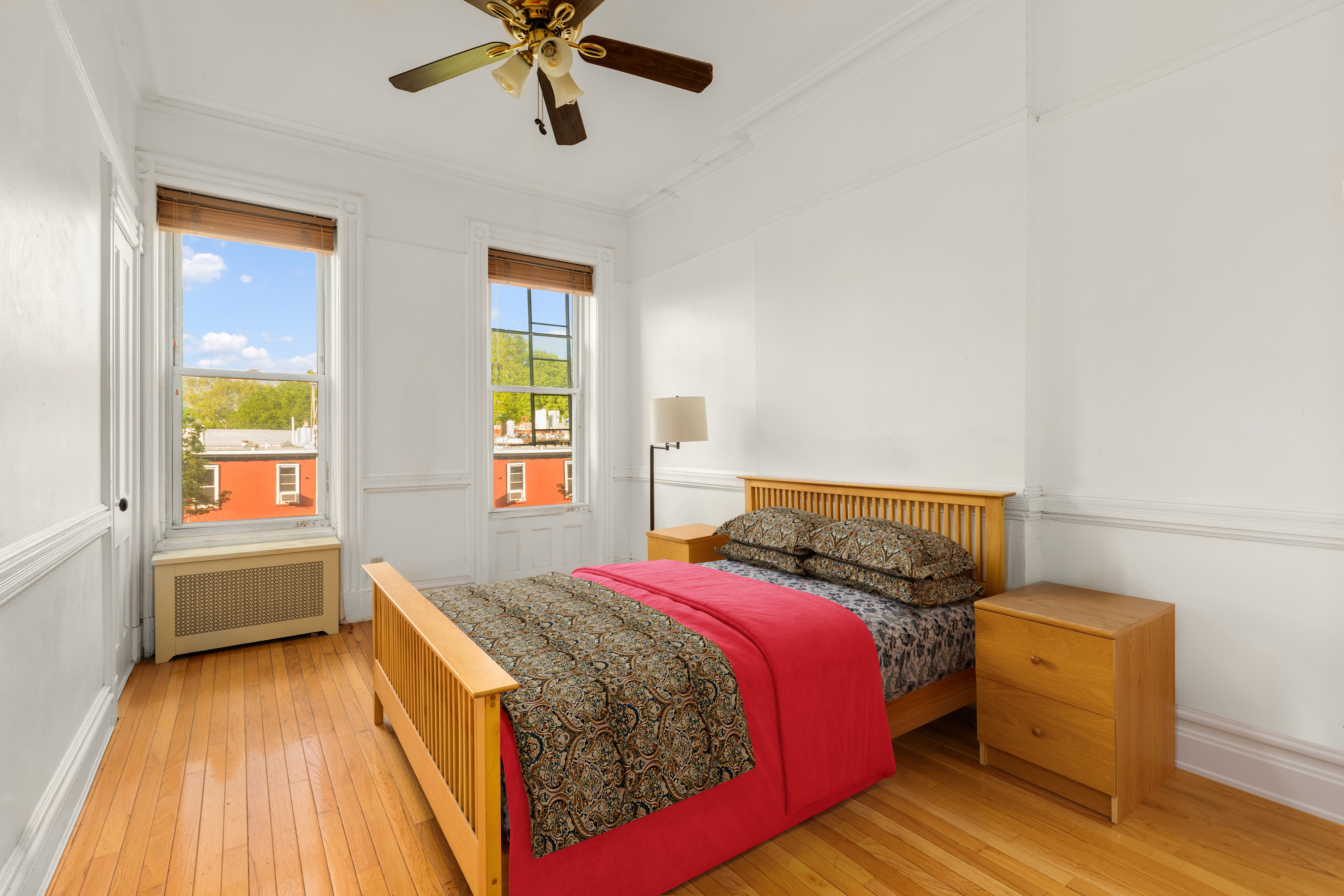 449 11th Street Brooklyn, NY 11215 - Photo 4 of 17 a bed room with a bed and a window