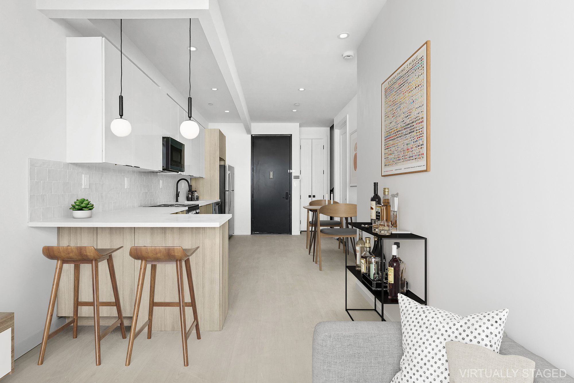 647 Dekalb Avenue, Unit 4B Brooklyn, NY 11216 - Photo 4 of 8 a kitchen with stainless steel appliances kitchen island a table and chairs in it