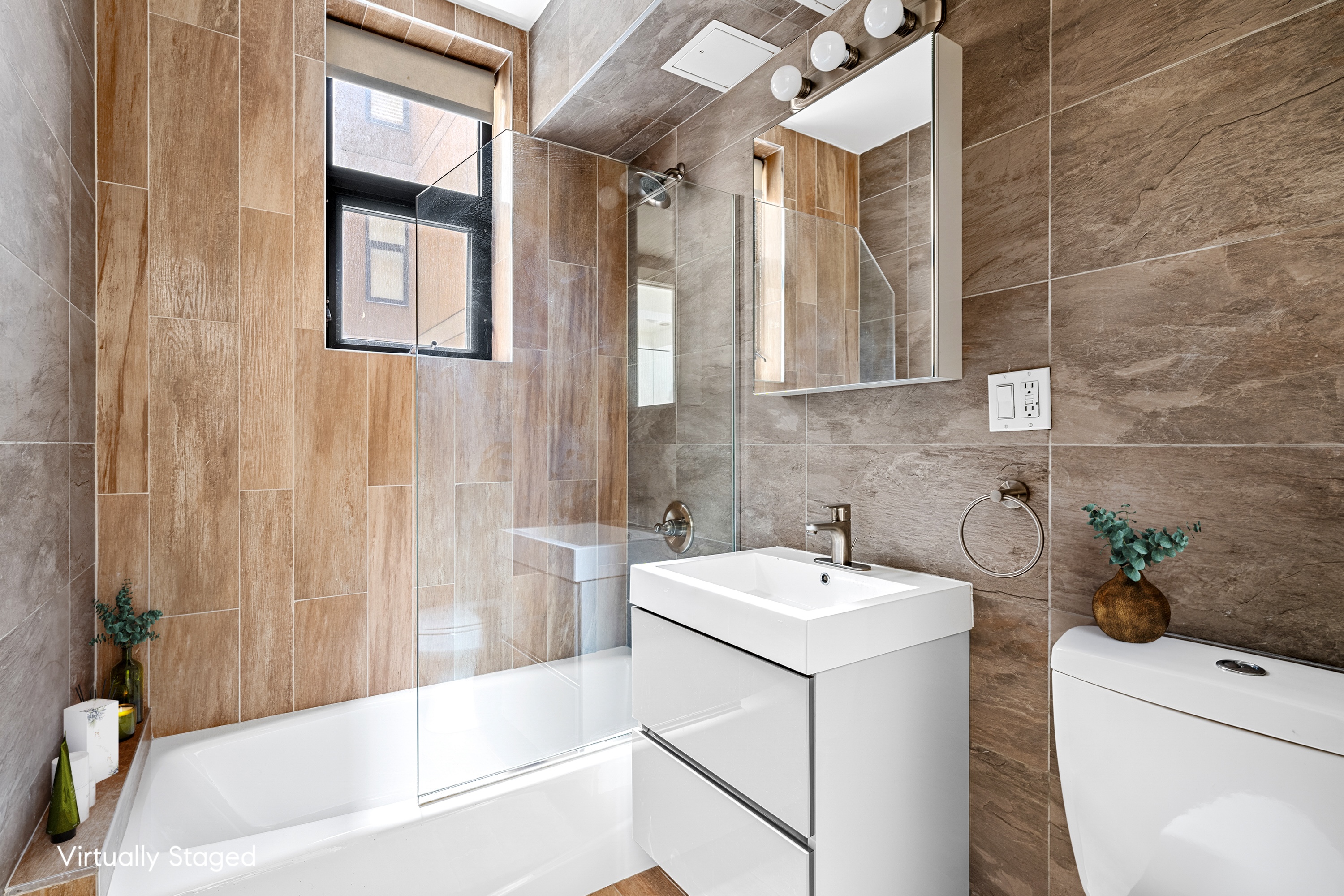 399 East 8th Street, Unit 1A Manhattan, NY 10009 - Photo 8 of 13 a bathroom with a sink and a bathtub