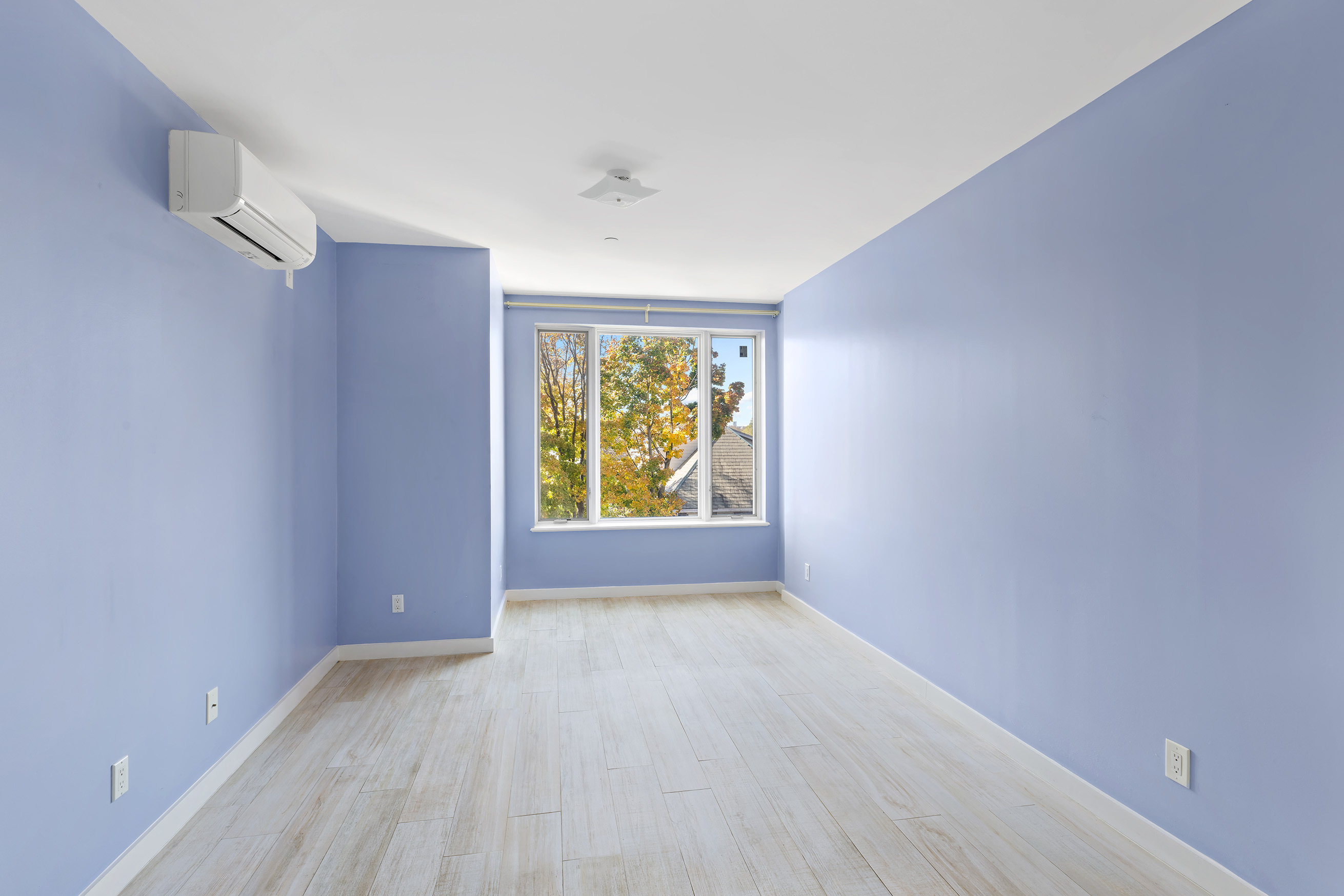 1972 Ocean Avenue, Unit 4A Brooklyn, NY 11230 - Photo 11 of 18 an empty room with windows