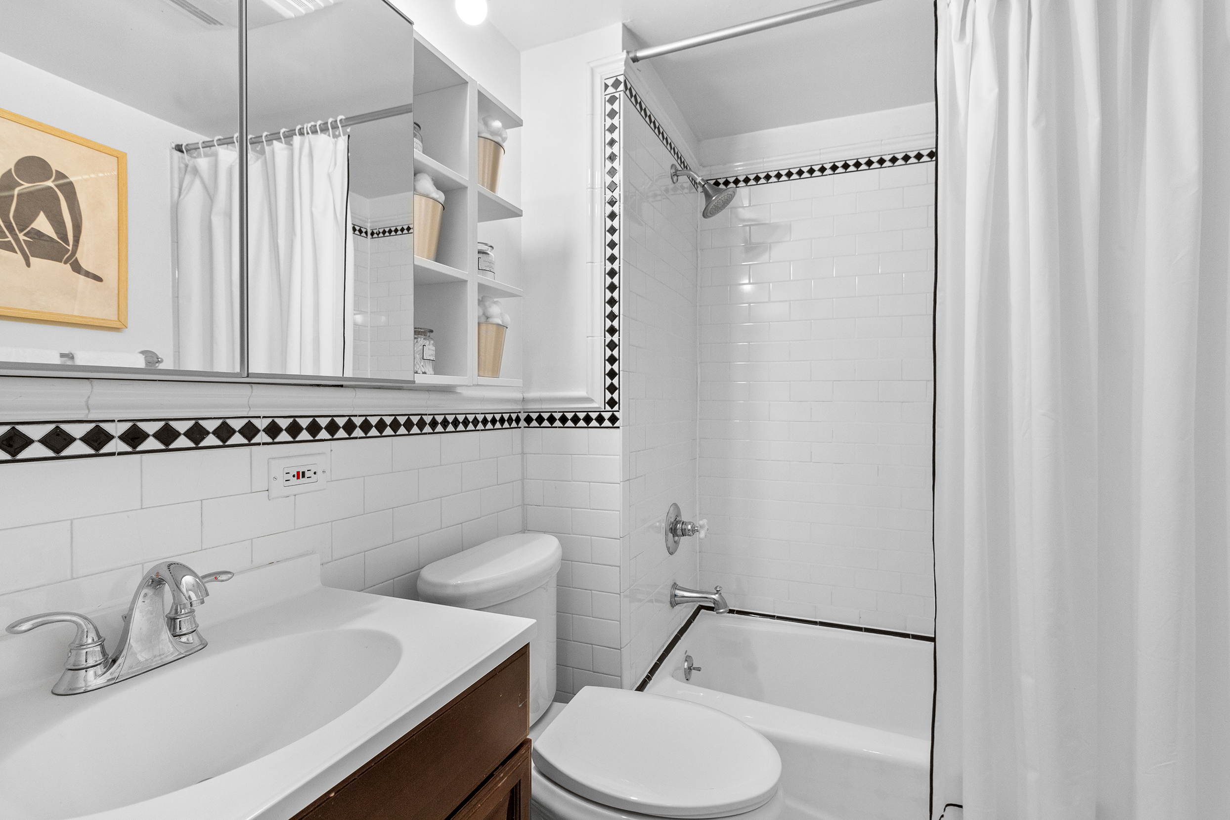 579 5th Street Brooklyn, NY 11215 - Photo 11 of 19 a bathroom with a sink a toilet a mirror and shower
