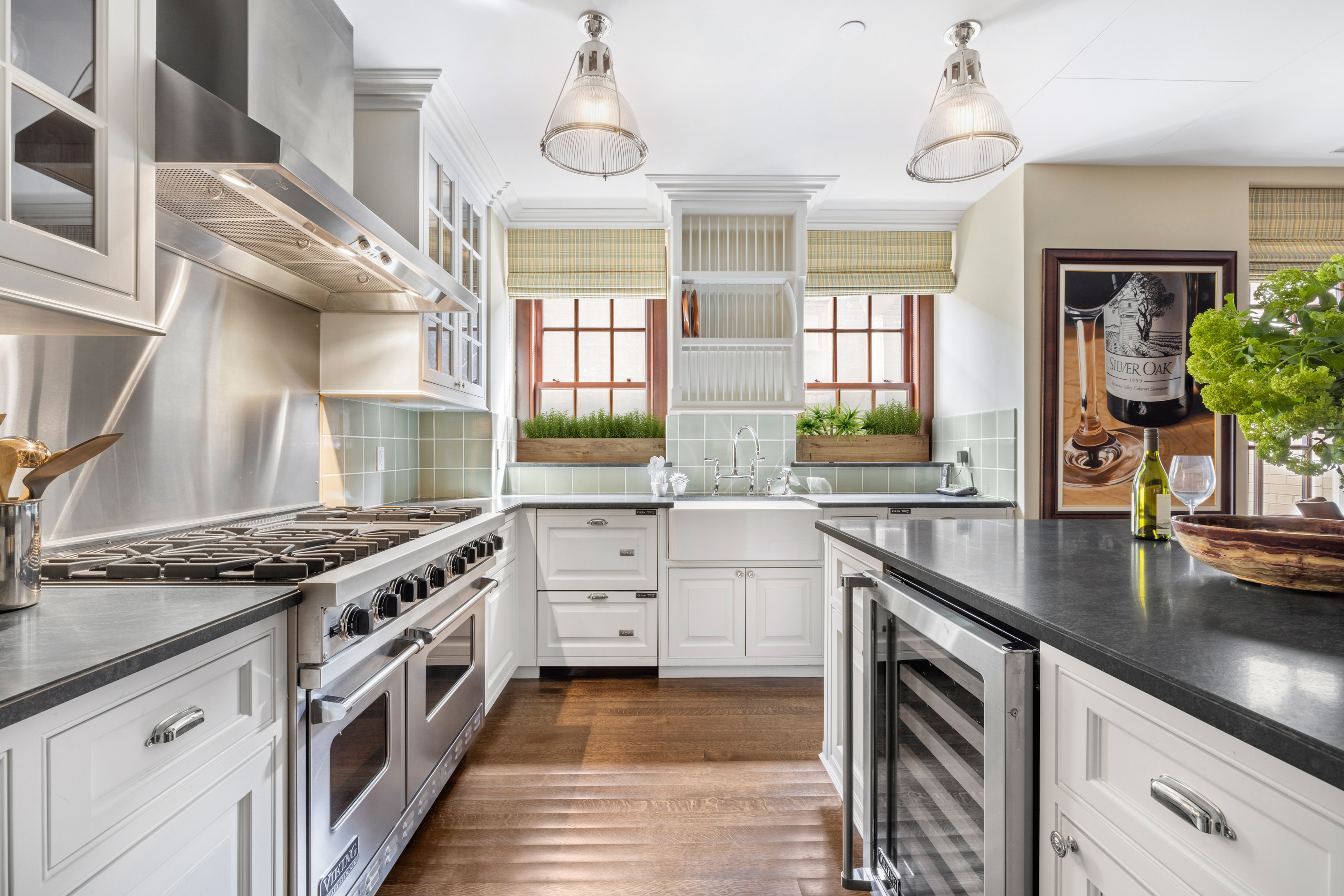 823 Park Avenue, Unit 5 Manhattan, NY 10021 - Photo 7 of 18 a kitchen with stainless steel appliances granite countertop a sink a stove and a wooden floors