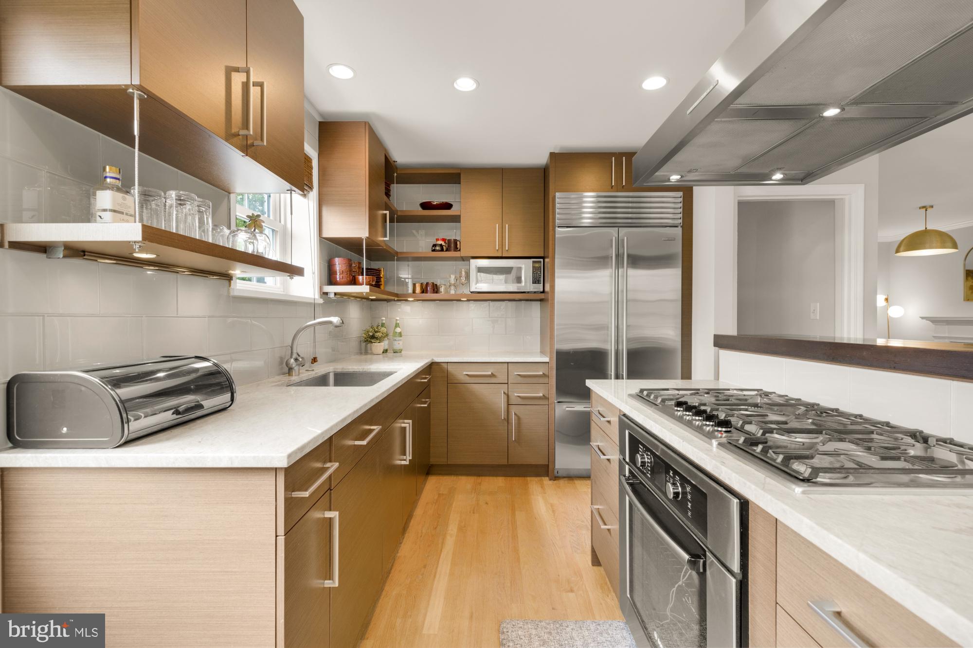 2611 Ross Road Chevy Chase, MD 20815 - Photo 14 of 37 a kitchen that has a sink a stove and a refrigerator