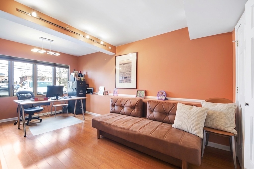 2310 East 66th Street Brooklyn, NY 11234 - Photo 16 of 24 a living room with furniture and a large window