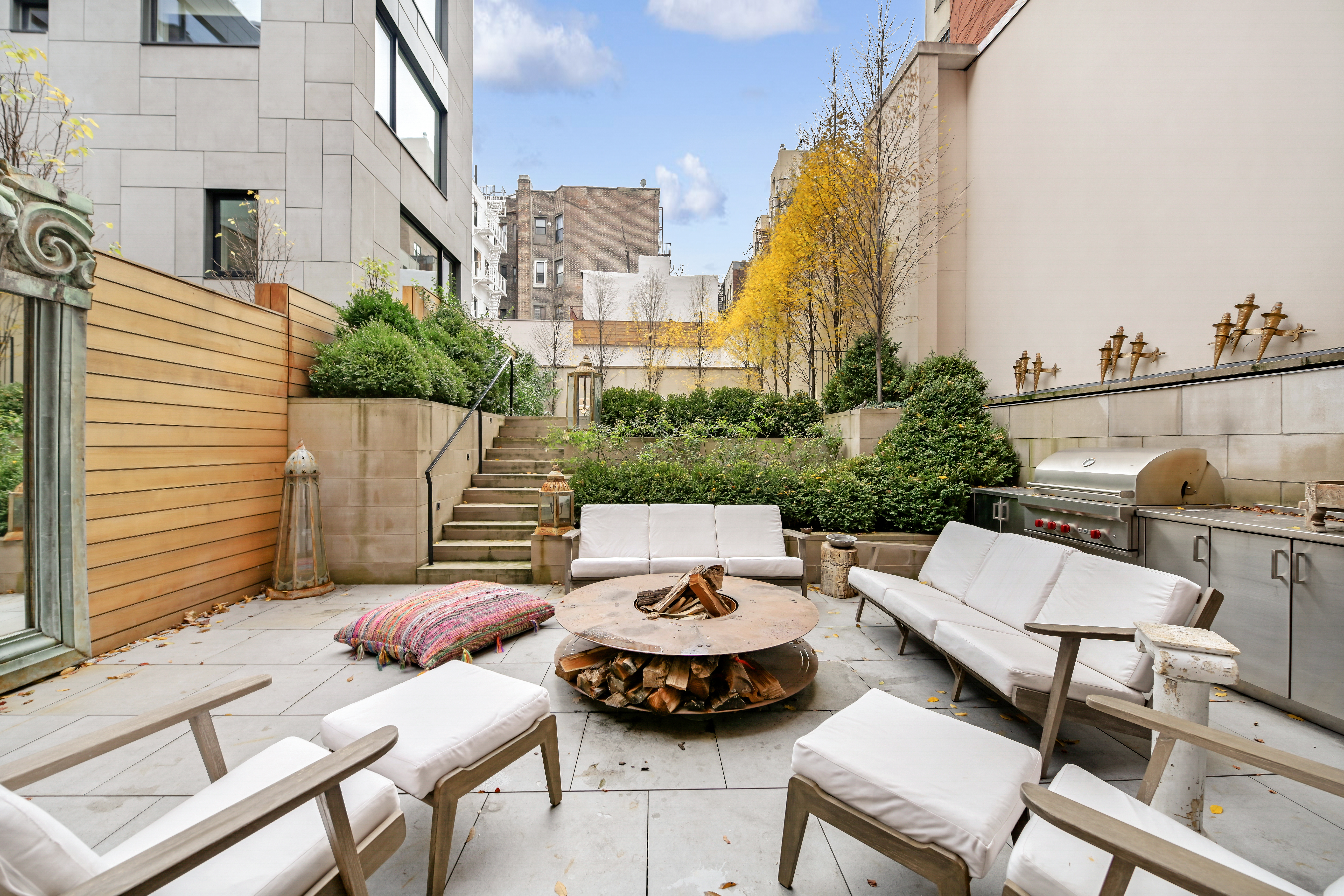 38 Prince Street Manhattan, NY 10012 - Photo 8 of 17 a view of a patio with couches table and chairs and potted plants