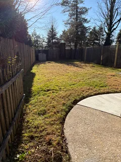 a swimming pool with wooden fence
