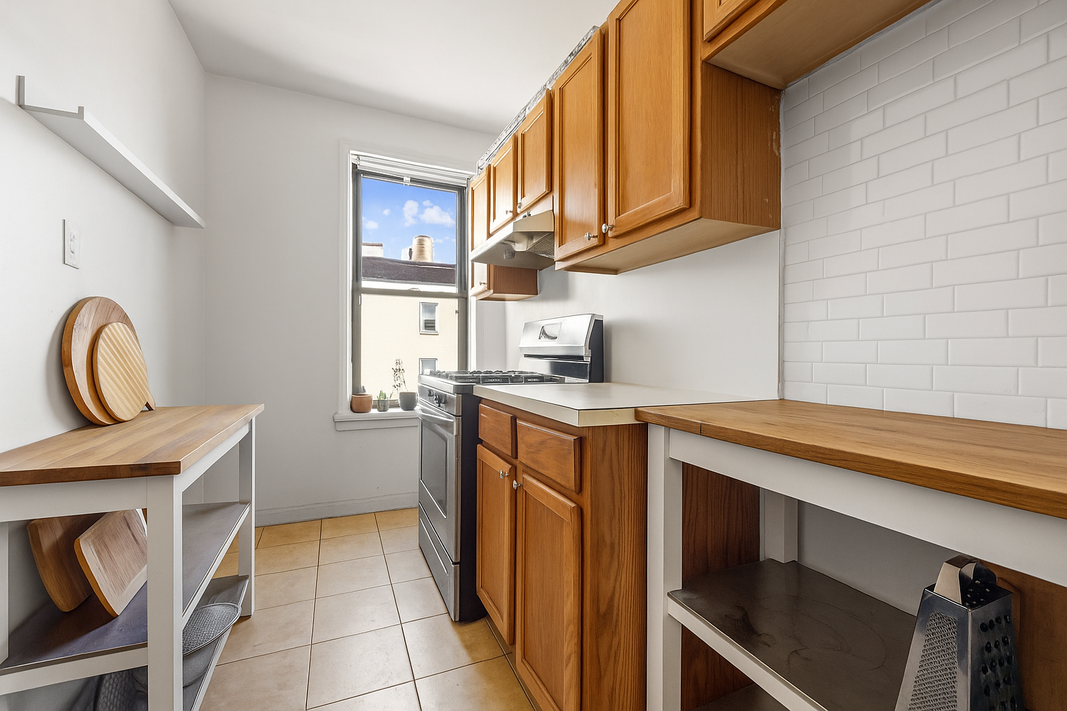 192-194 Union Street Brooklyn, NY 11231 - Photo 21 of 37 a kitchen with stainless steel appliances granite countertop a sink stove and cabinets