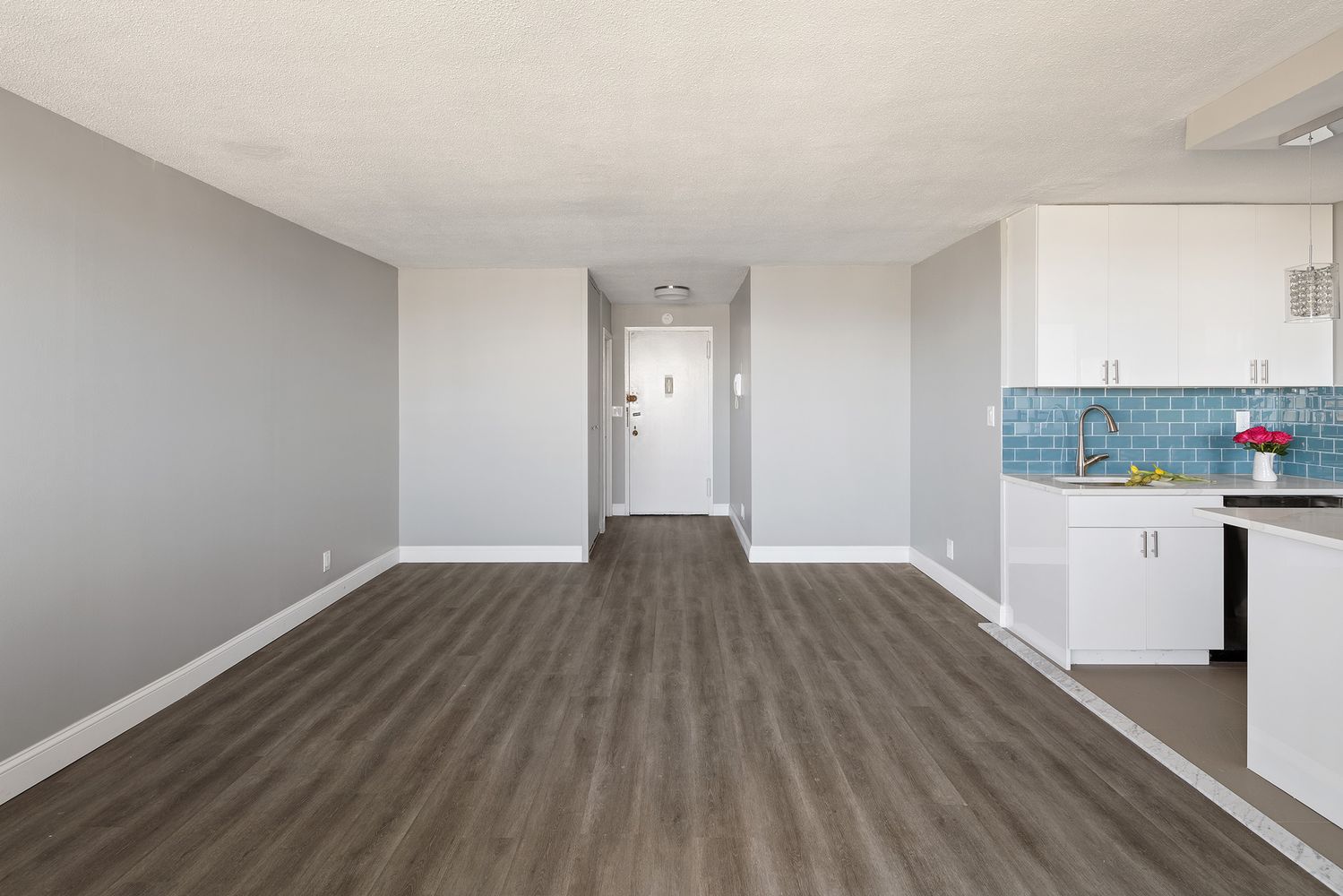 a view of kitchen with wooden floor